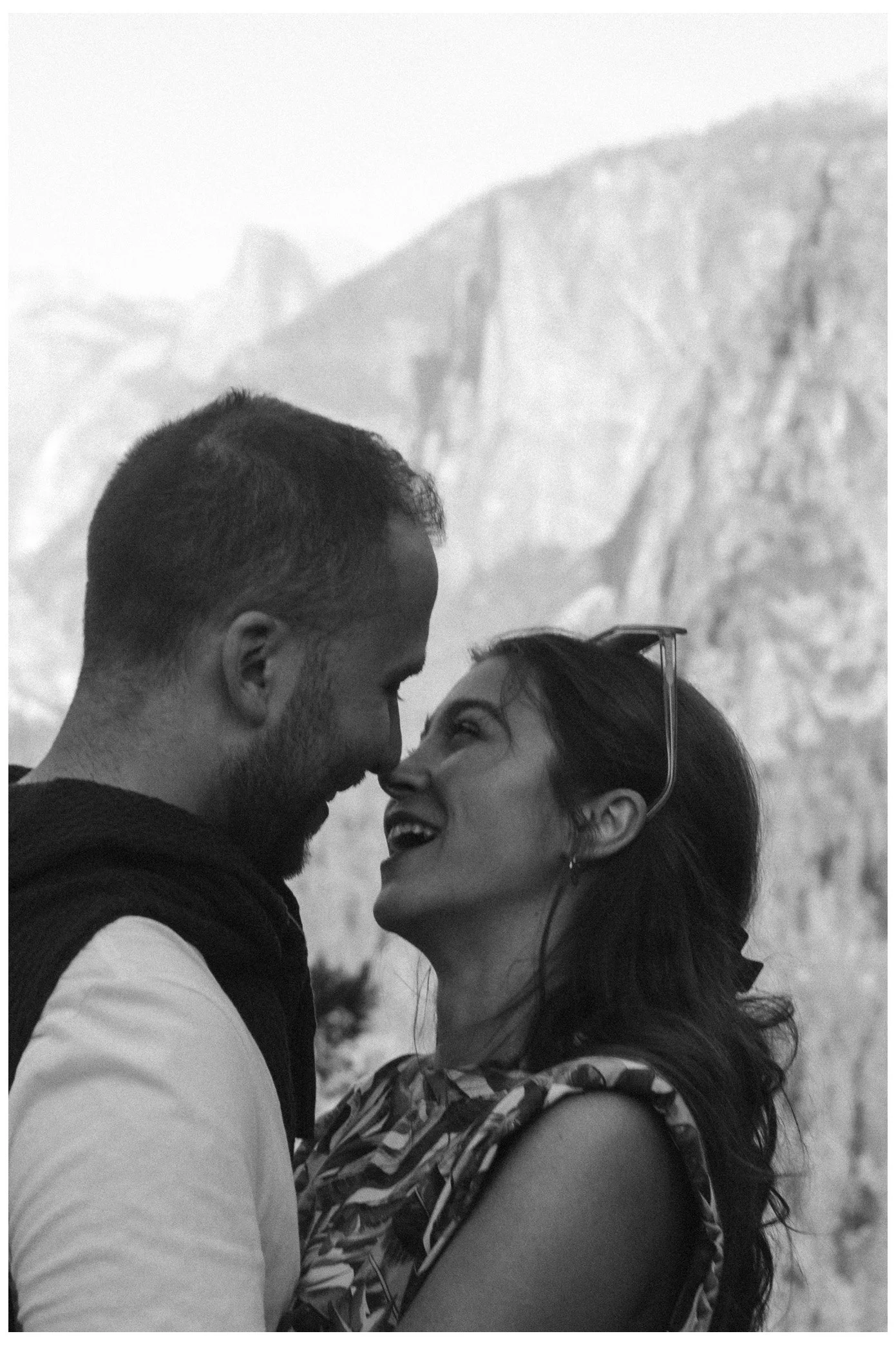 engagement / couple - she said yes and they are full of love. the couple looking at each other, about to kiss