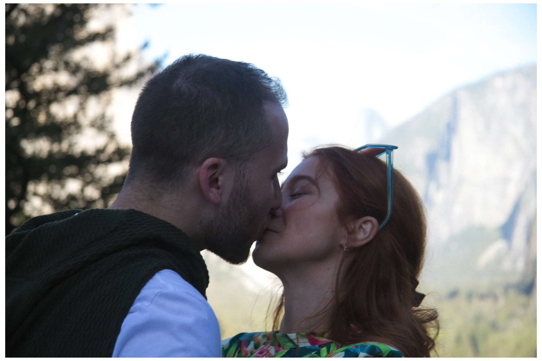 engagement / couple - she said yes and they are full of love. the couple kissing