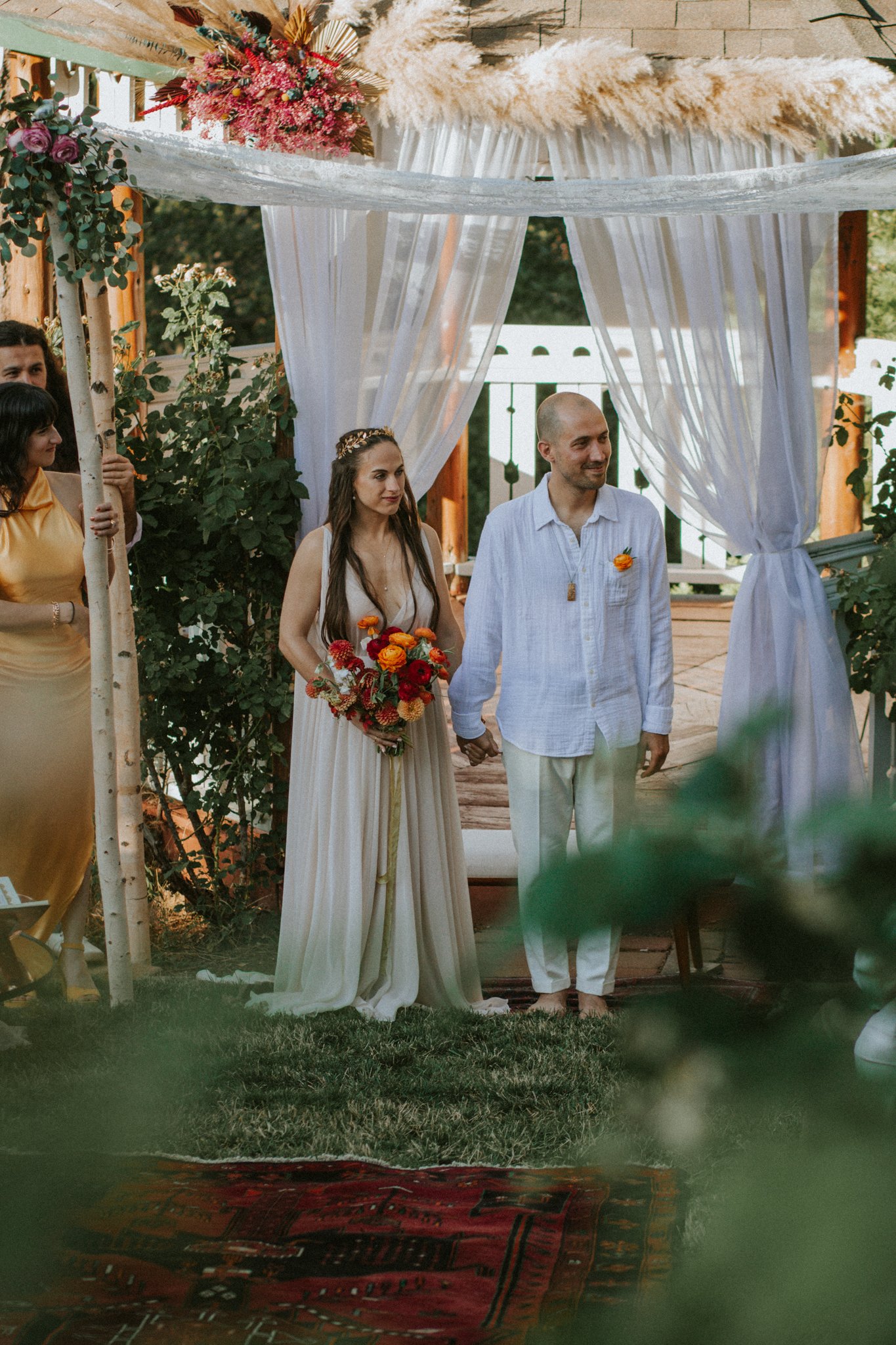 wedding day - couple standing in front of their people