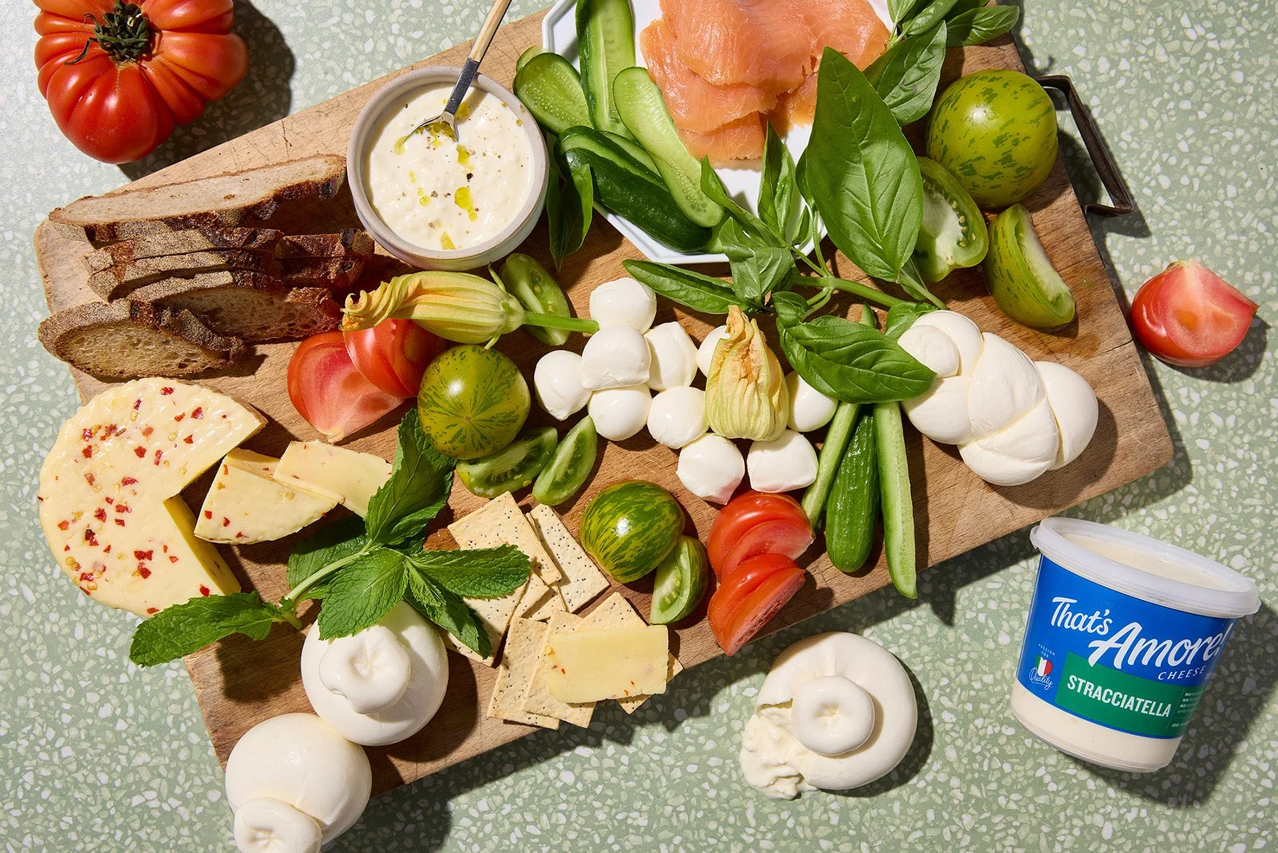 sunny italian cheese platter on green terrazzo