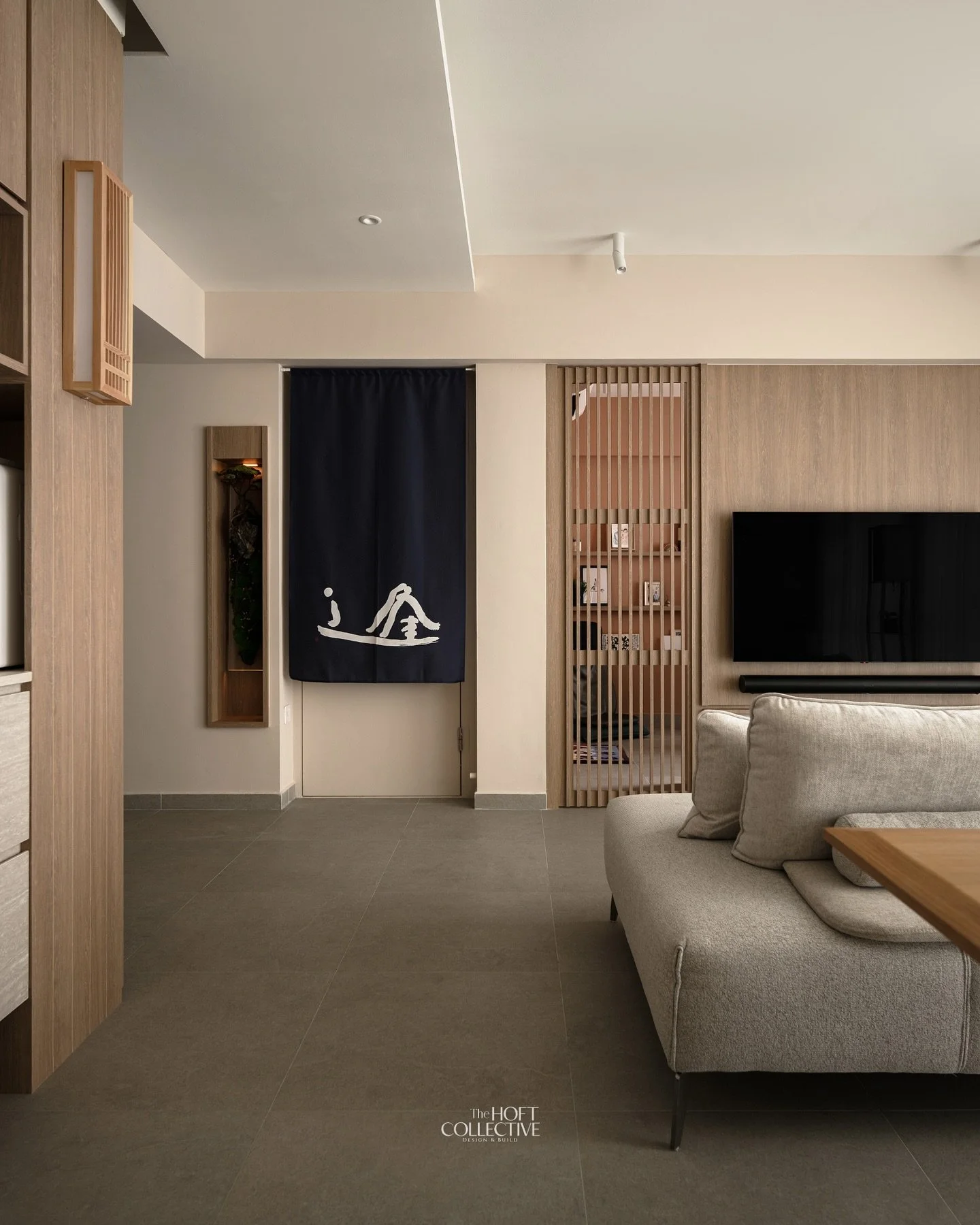 Characterized by clean lines, a dedication to natural materials (especially light wood), an uncluttered environment and a carefully considered blend of soft textures and linear elements. The integration of the wood feature wall and the slatted divide