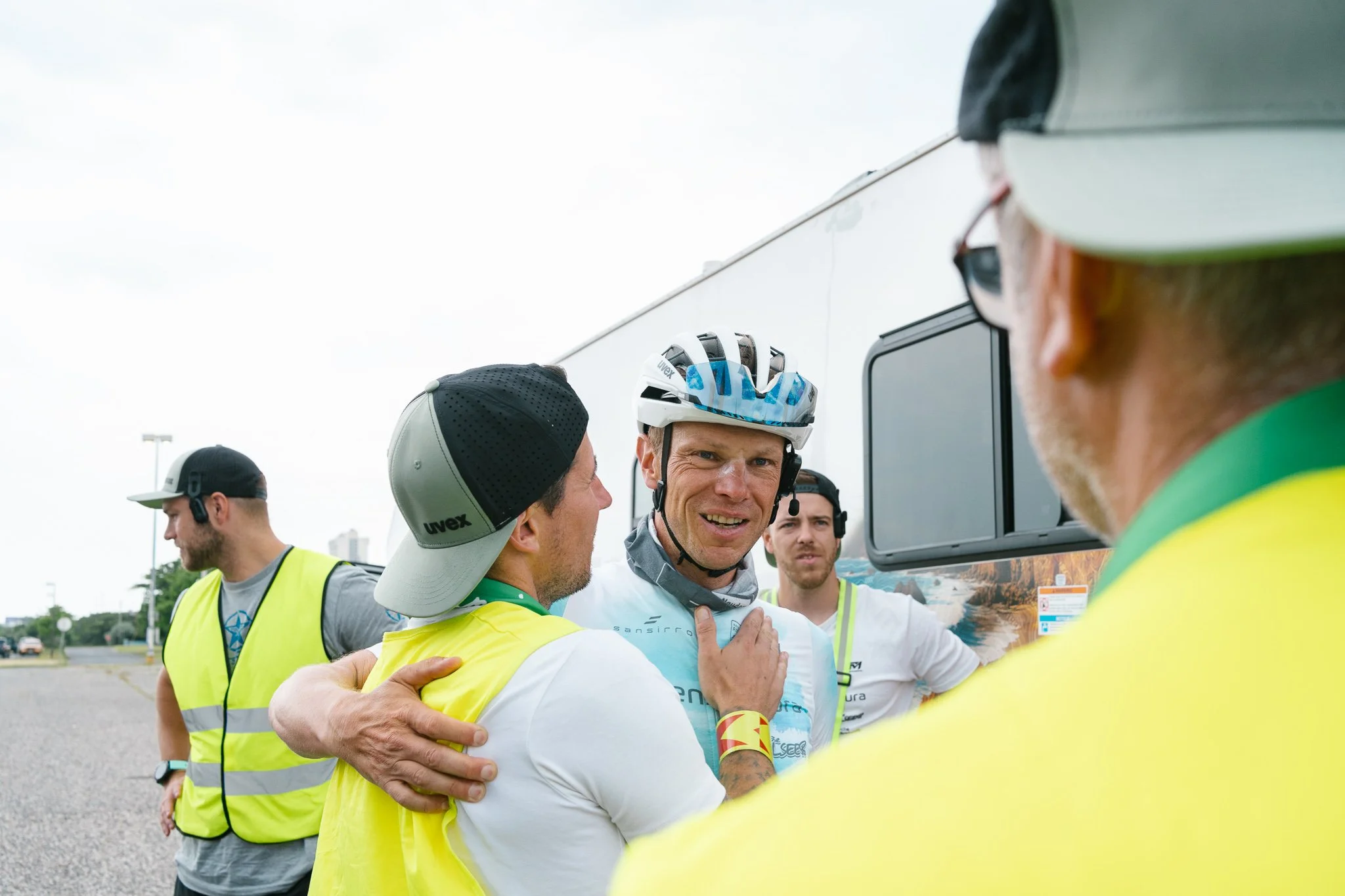 Where the clock stops — the finisher's smile, shared first with his crew chief.
