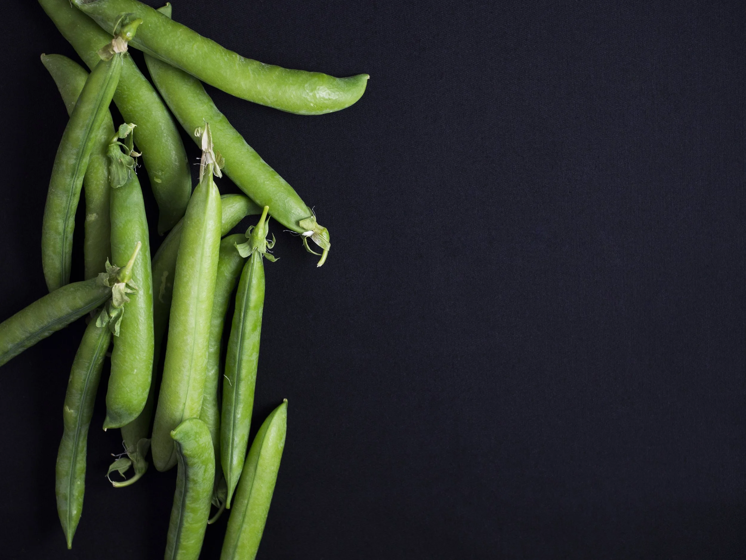 Green Beans on a dark background