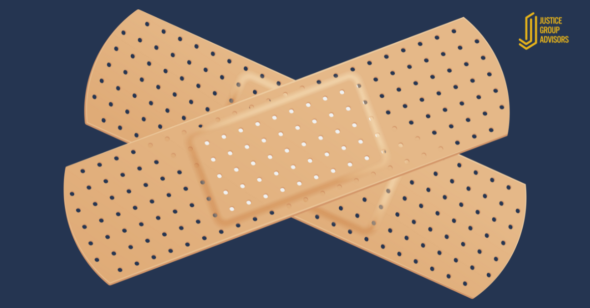 two bandages in x shape on navy blue background with justice group advisors logo in corner illustrating if it only sorta works, it is a bandaid solution