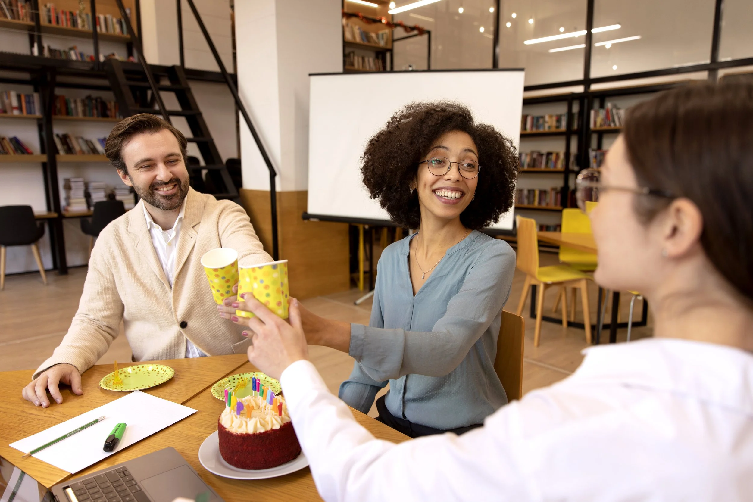 Teachers in conversation over coffee.