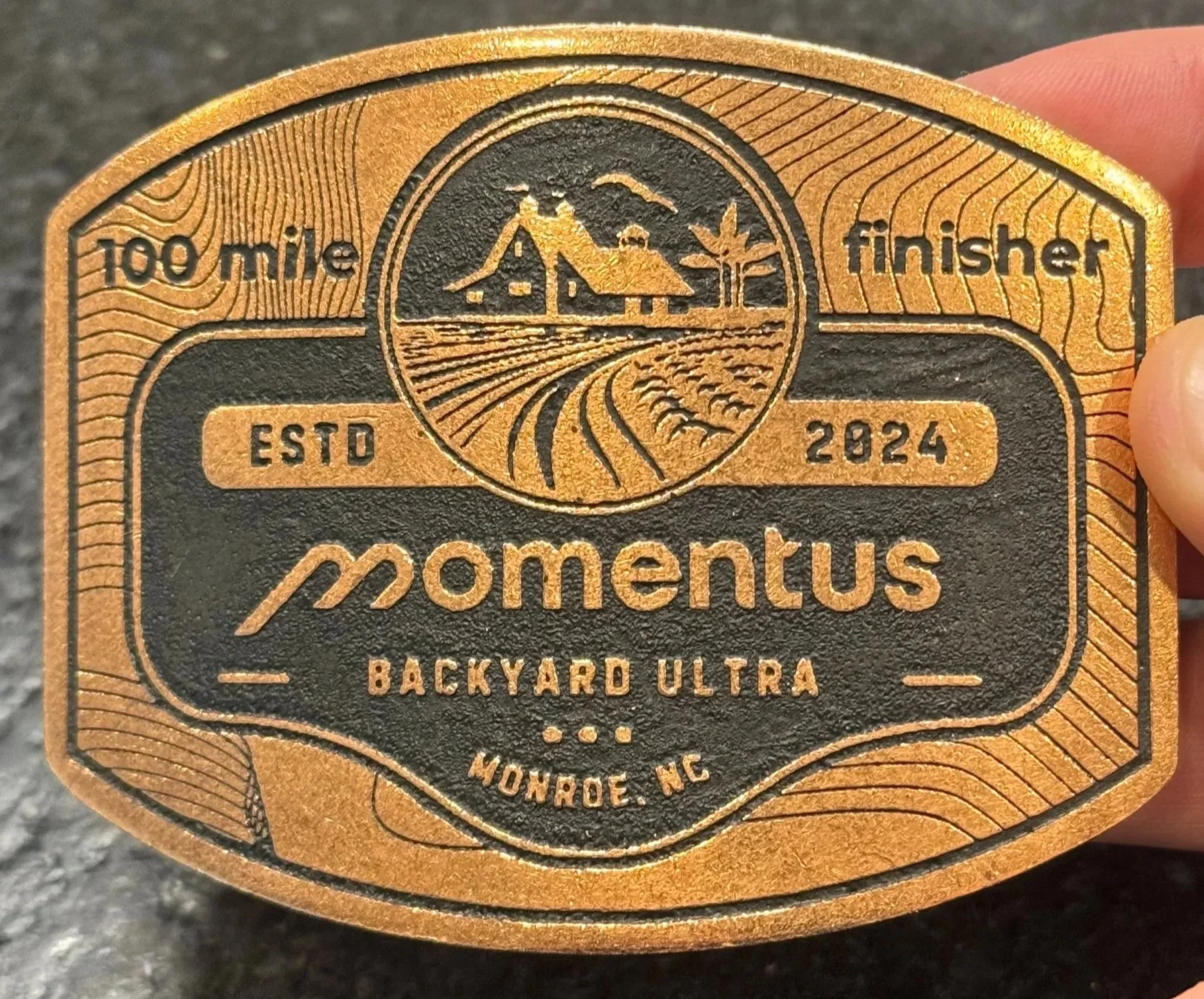 Picture of the 100 mile belt buckle
