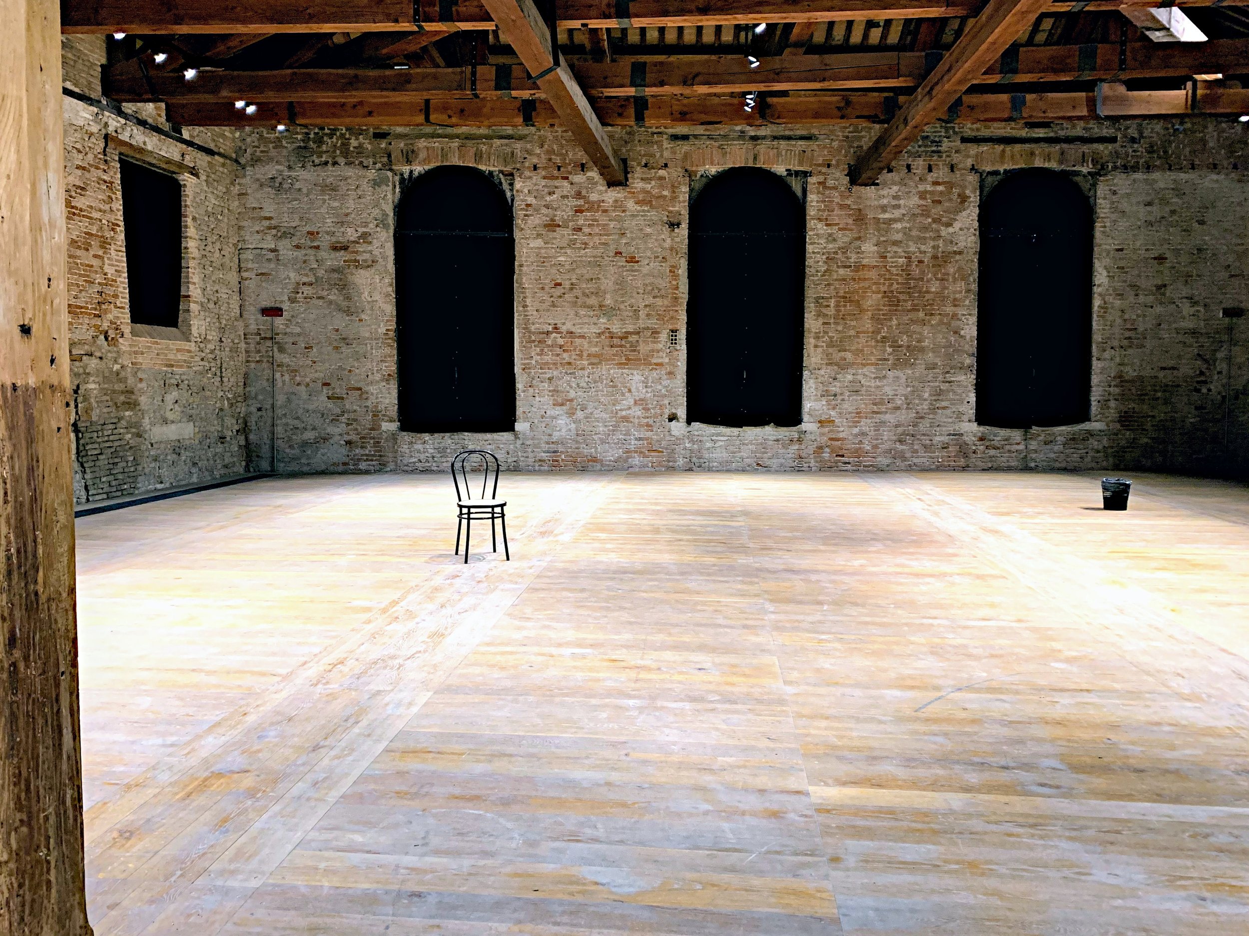 Empty warehouse room with a chair