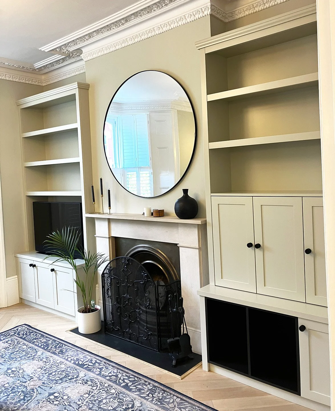 Bespoke fitted alcove shaker cupboards and shelves in a grand living room in Finsbury Park, London.