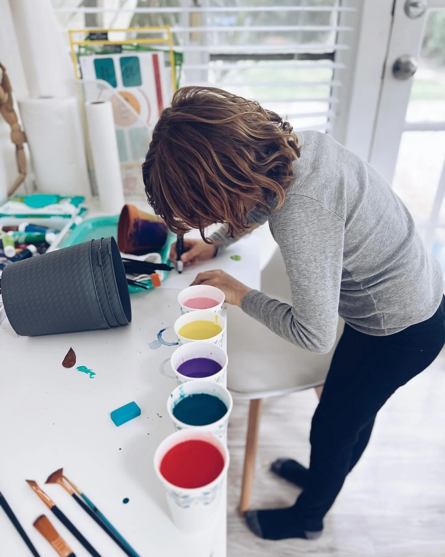 Emotional regulation can be as simple as mixing paints and pouring them from one cup to another - there's no one 'right' way. Our nervous system intuitively seeks out what calms us, returning us to a balanced state. By embracing patience, flexibility