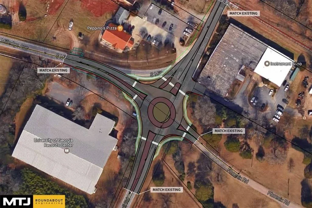 Aerial view of a roundabout design proposal at the intersection of Milledge Avenue and Phoenix Road, showing traffic flow, road markings, and nearby landmarks such as Peppino's Pizza and University of Georgia Records Center.