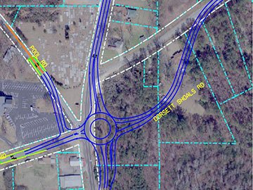 Aerial view of a road roundabout at the intersection of Pool Rd and Dorsett Shoals Rd, depicted with blue lines and surrounding terrain in a map format.