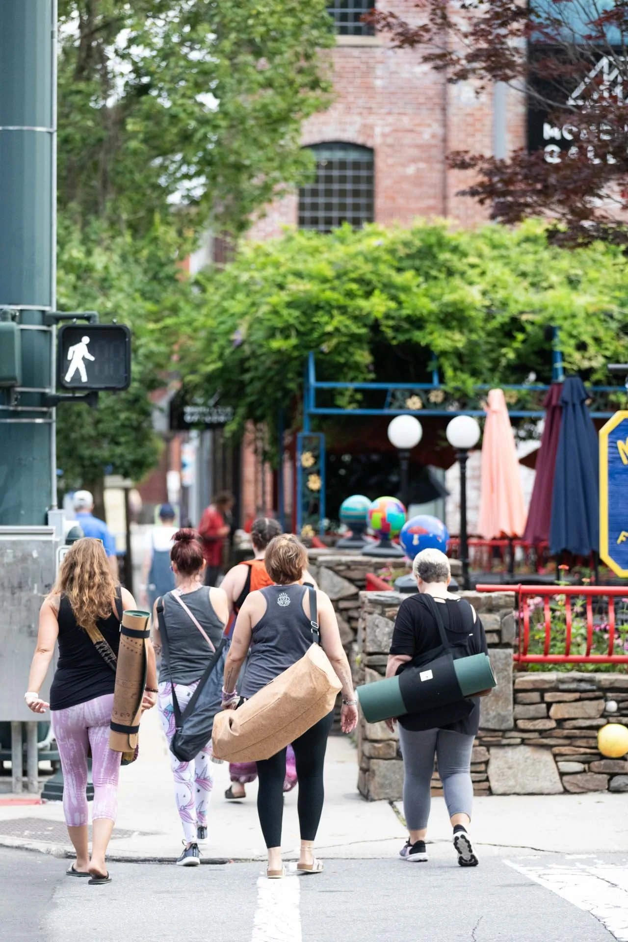 People-with-yoga-mats-crossing-street.jpg