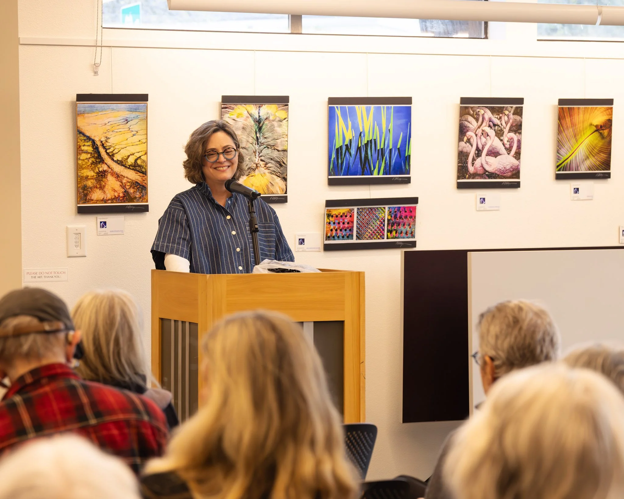 Erin Malone reads during April's Open Mic Event, 2026. Photo by Mandi May.