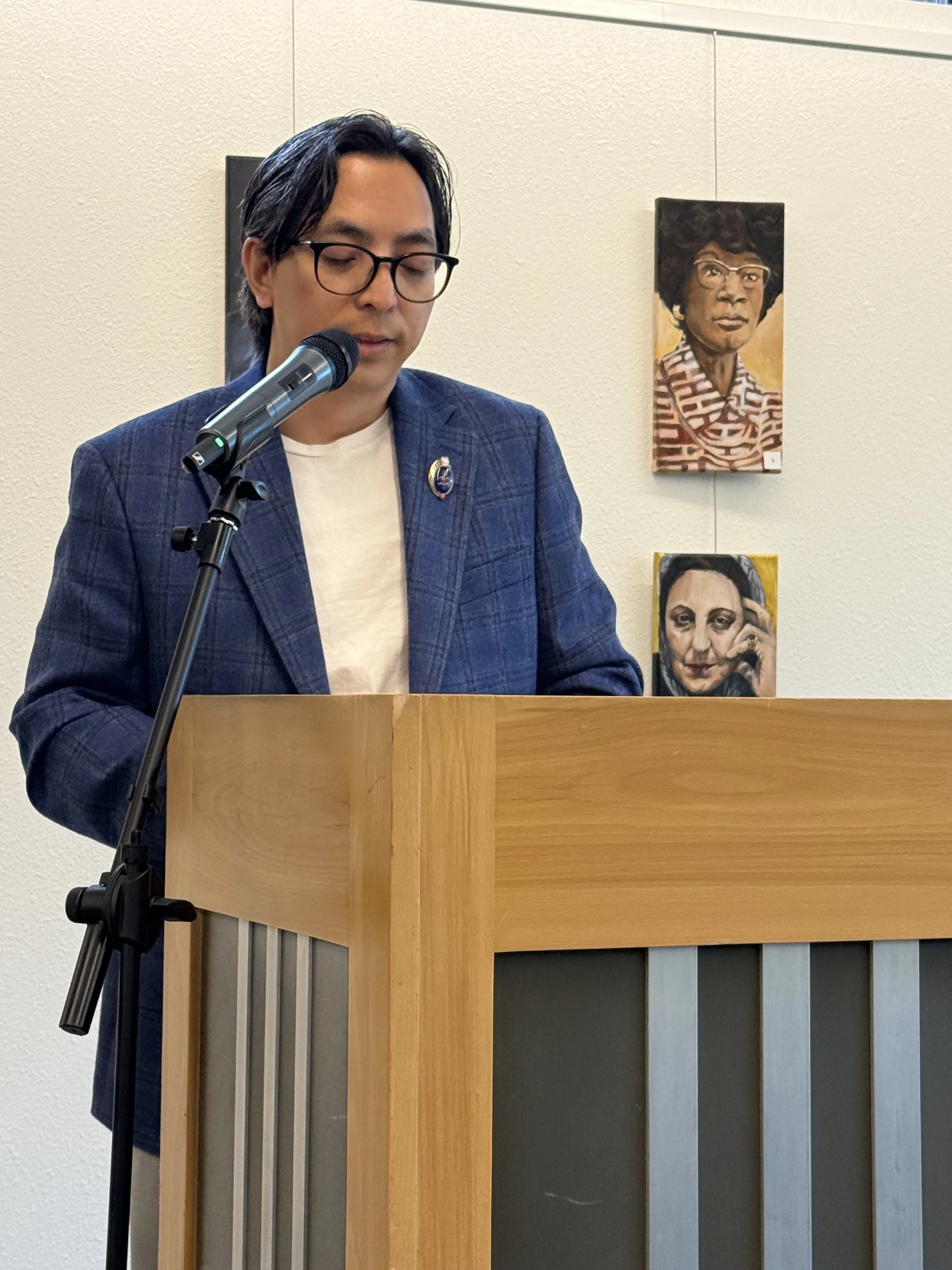 Guest Reader Samyak Shertok reads at May's Open Mic, 2026.
