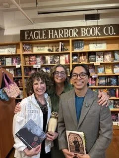 Michele Bombardier and Samyak Shertok pose with Erin Malone at their book signing, May 2026.
