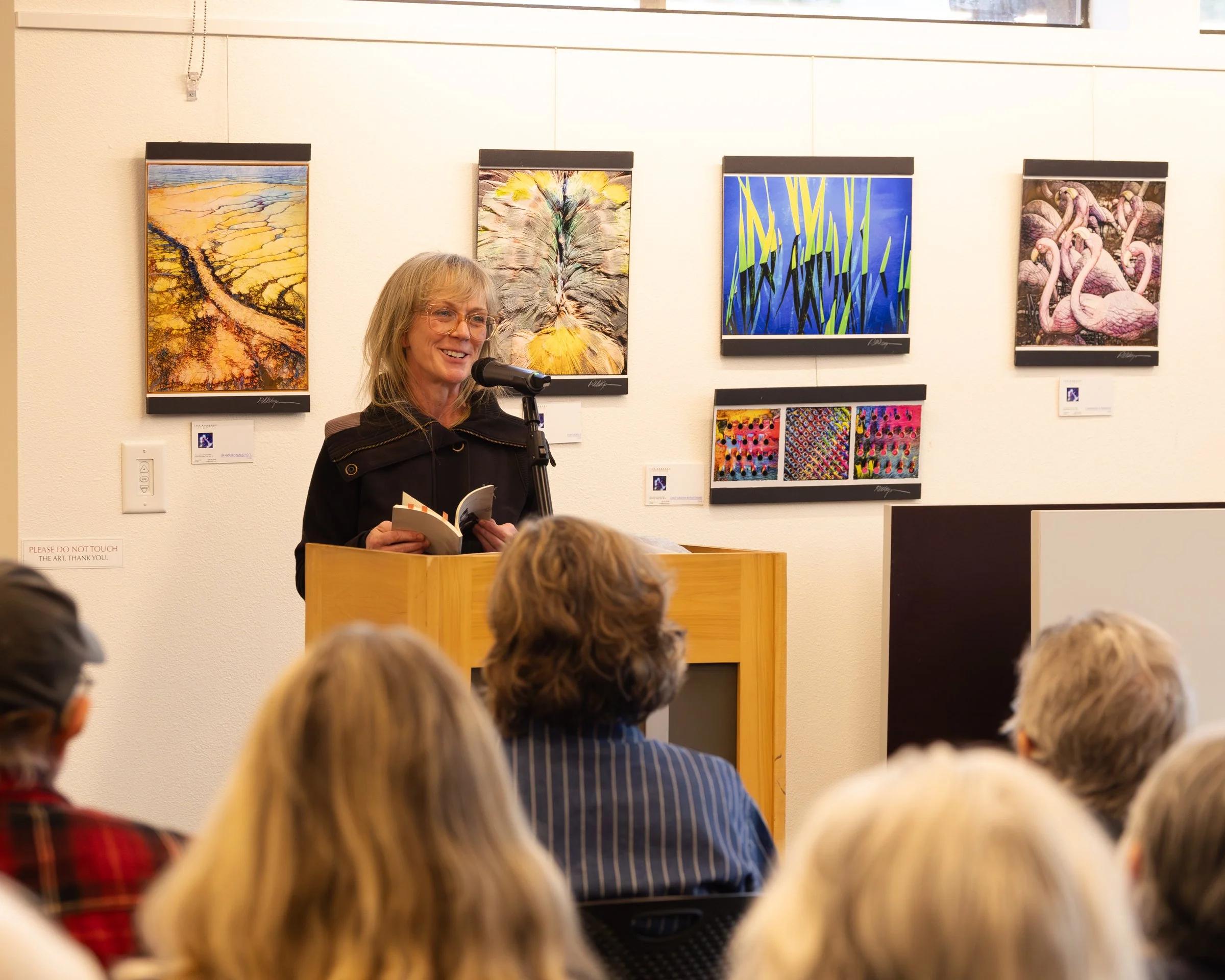Guest reader Kary Wayson reads during April's Open Mic Event, 2026. Photo by Mandi May.