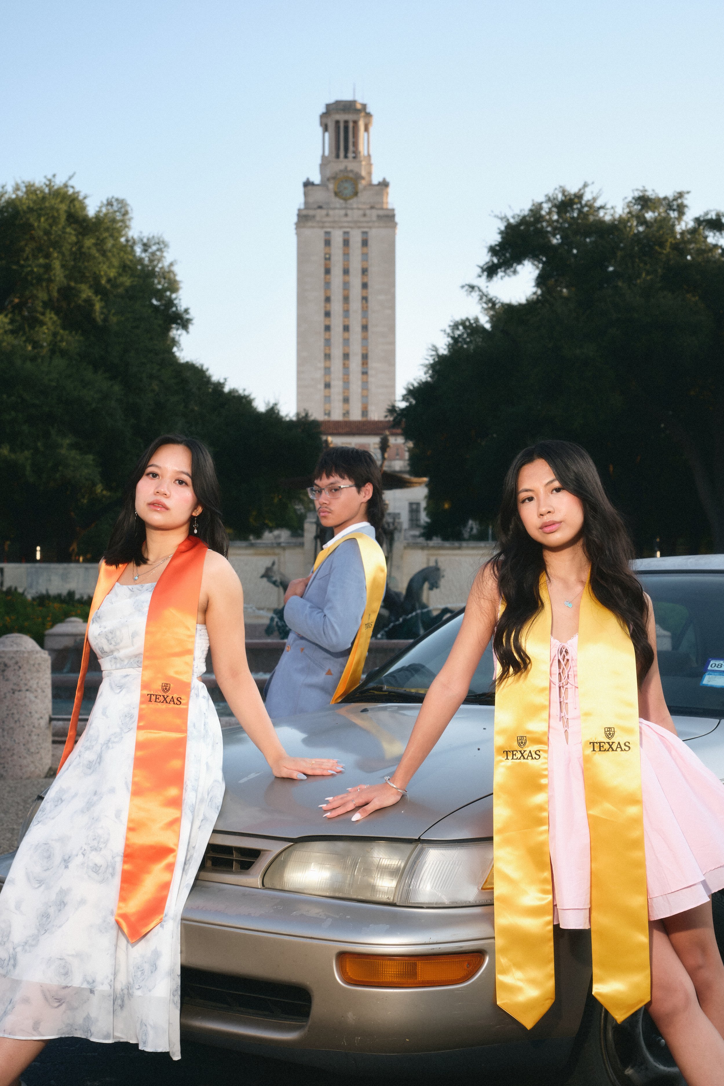Group graduation photos at UT Austin – Celebrate with friends and classmates in a fun-filled session.