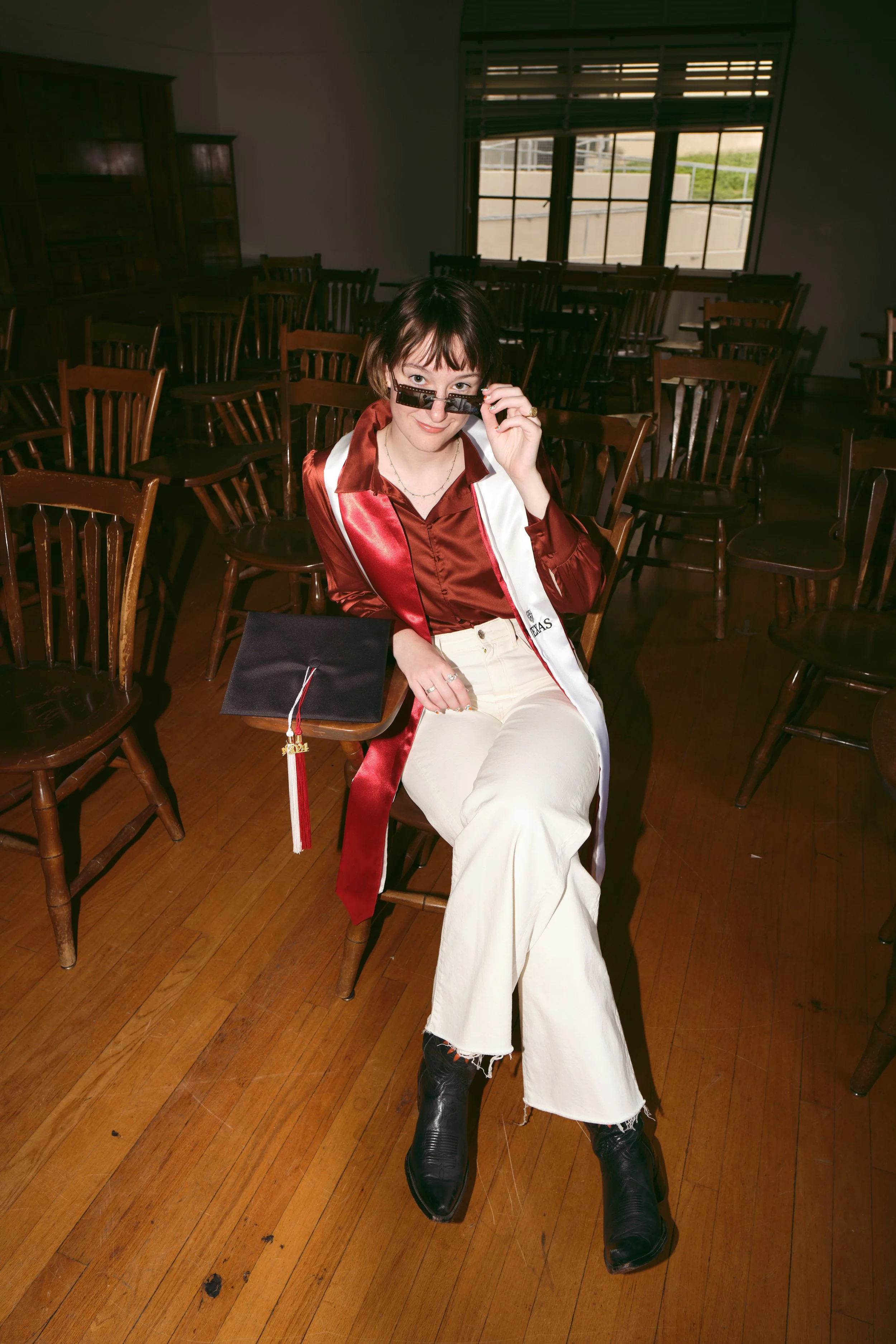 Luxury editorial graduation photography at the University of Texas, where your cap and gown become high fashion and your diploma shines like the jewel it is.