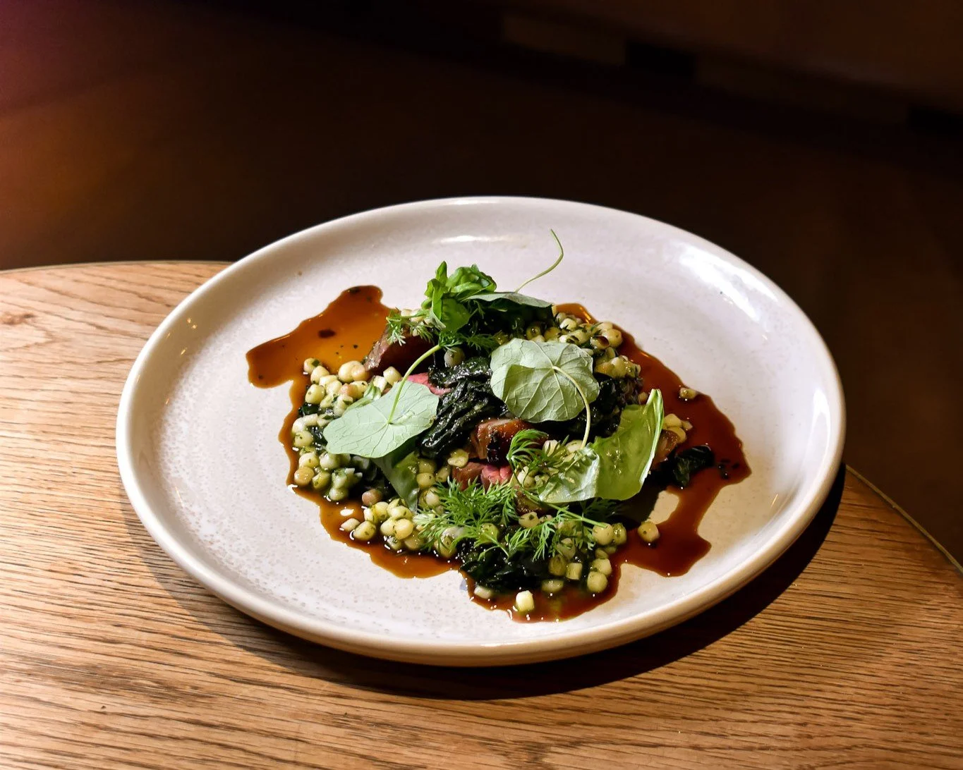 Lamb with fregola, greens and jus from the seated dining menu