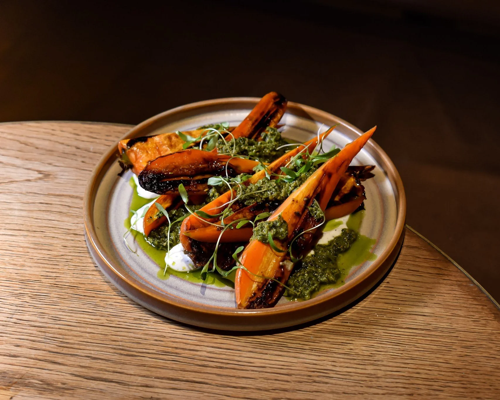 Roasted carrots with salsa verde and microgreens, a vegetarian shared plate