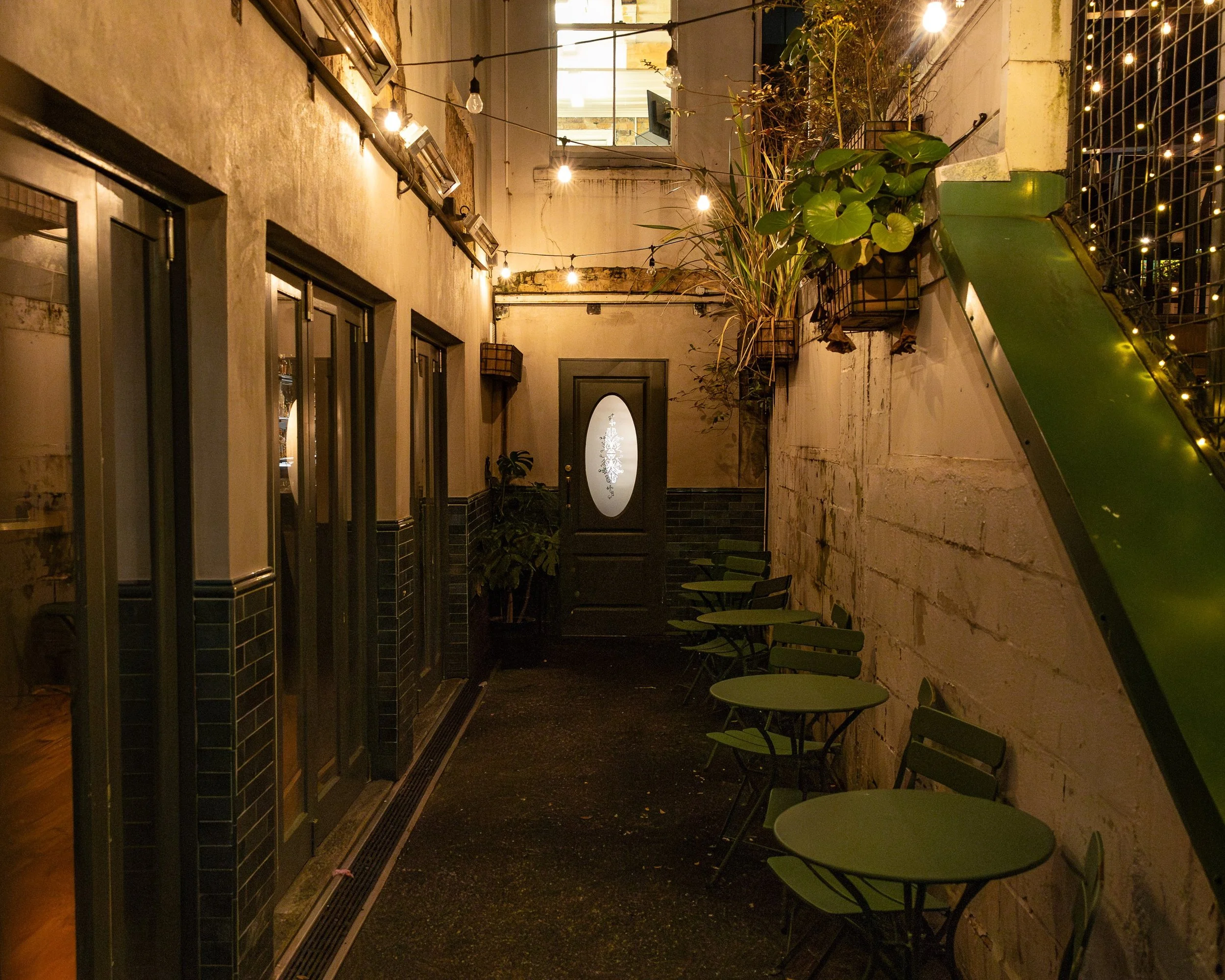 The lantern-lit laneway leading to Baxter's, the private functions bar off Federal Street