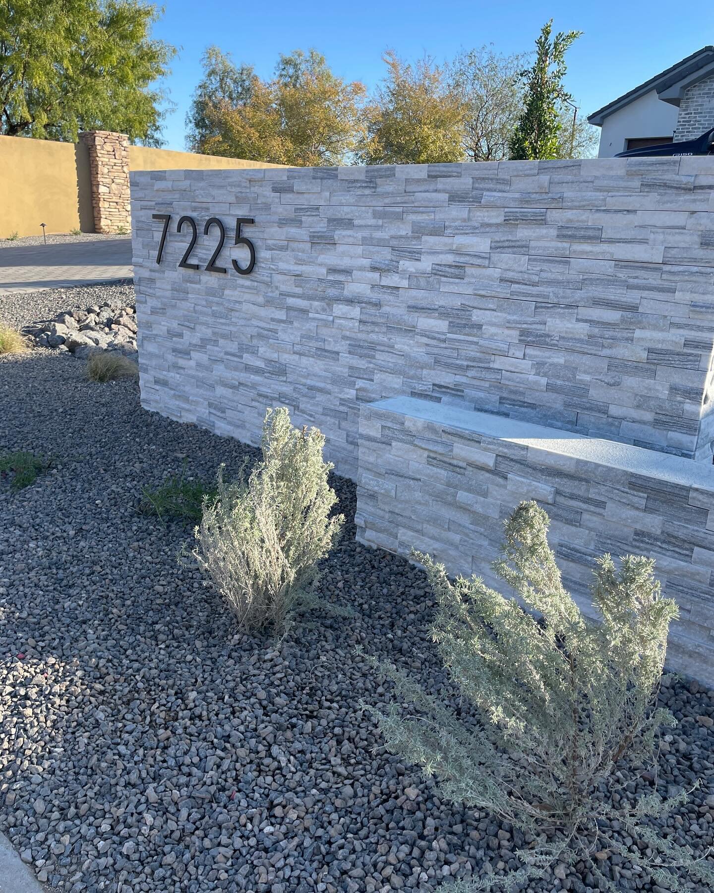 Front yard and courtyard refresh! We installed a decorative wall with house numbers, placed planters around the courtyard entrance, and installed beautiful trellises to the courtyard space. 🤩 More soon!