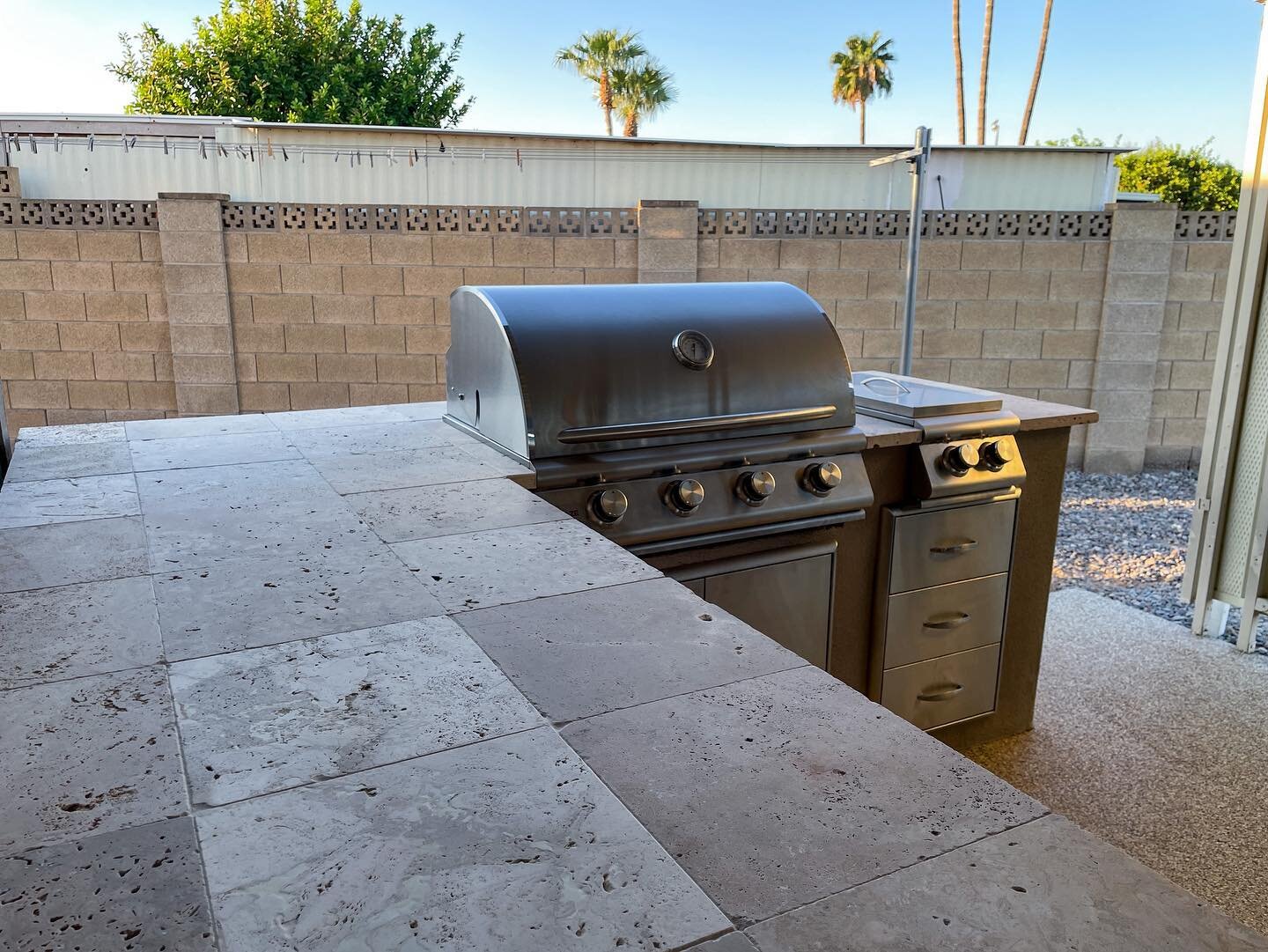 The perfect space for entertaining! A recently completed custom outdoor kitchen with a stucco finish and travertine top. Call us today for a free estimate!