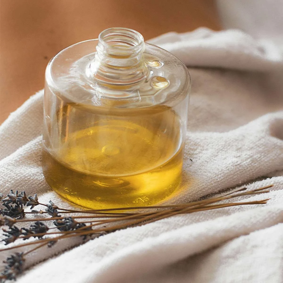essential oil and lavender on a massage table
