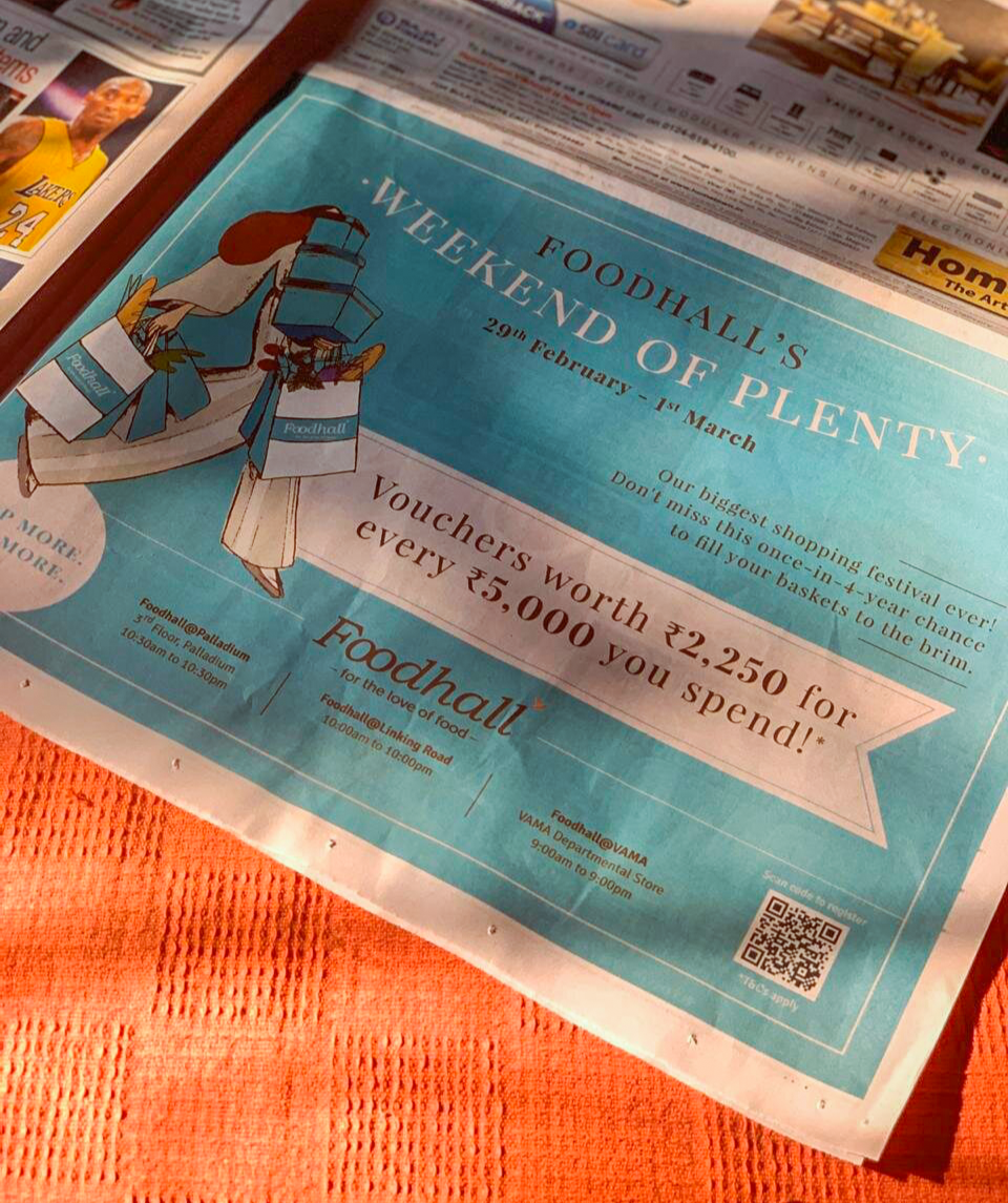 Advertisement flyer for Foodhall's Weekend of Plenty from February 29th to March 1st, featuring a shopping-themed illustration and vouchers worth ₹2,250 for every ₹5,000 spent.