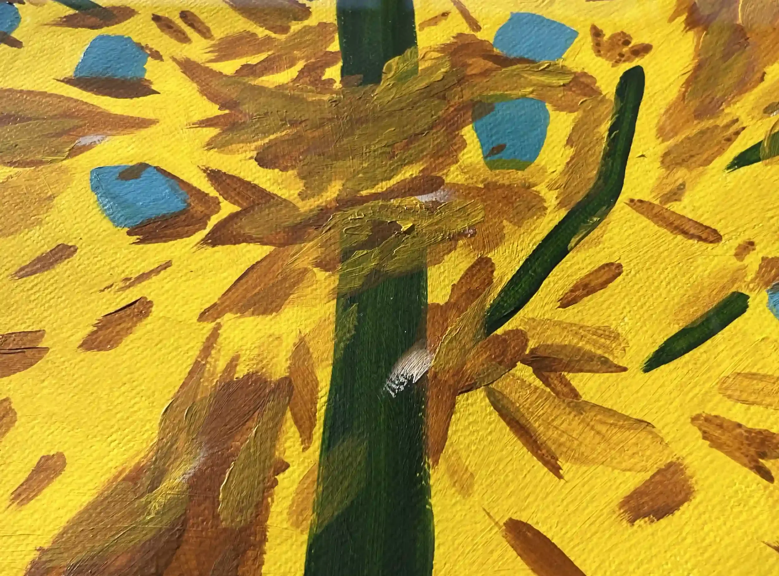 Close-up of a painting featuring a bright yellow background with brown and blue scattered spots and a prominent green strip in the center.