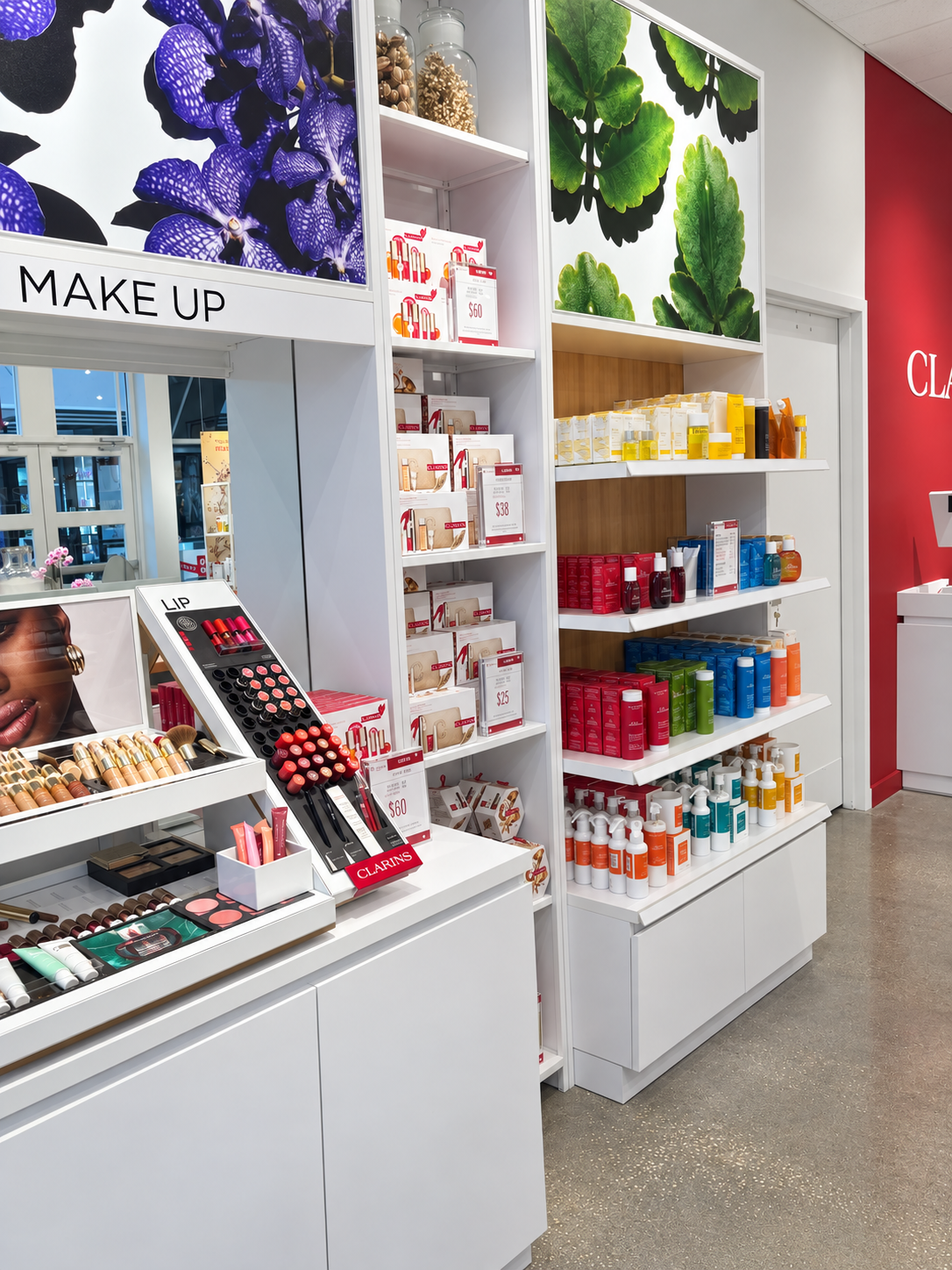 Clarins makeup display with floral lightbox-2.png