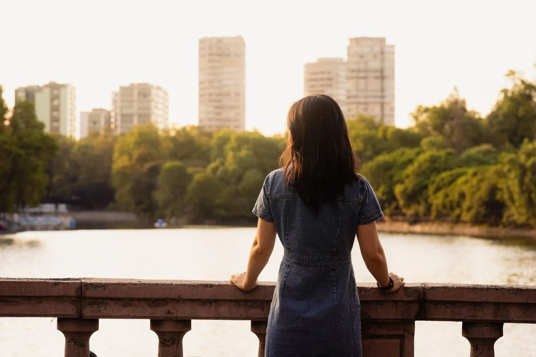 a woman looking at the city
