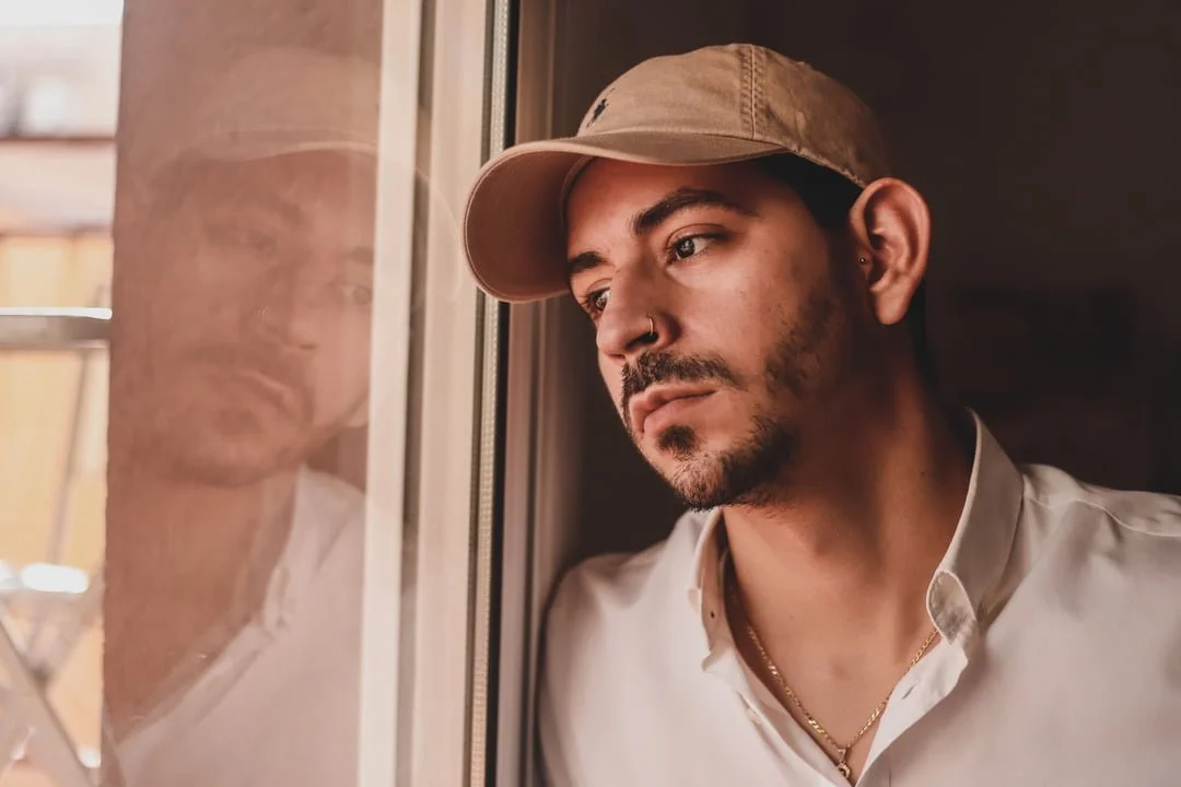 a man looking out the window