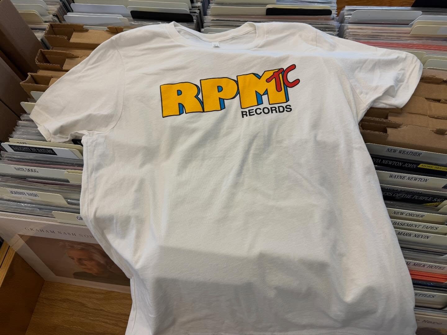 New RPM Shirts &amp; Hats available Next Saturday for Record Store Day! We Open Early at 9AM and as always this is a 1st come first served event so set those alarms. 🚨 
.
Free Coffee &amp; Donuts wail they last 🍩 
We also have Sabores y Colores Tac