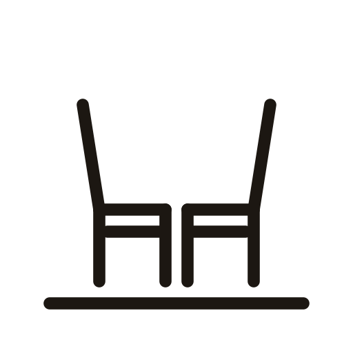 Two chairs facing each other in front of a table on a black background.