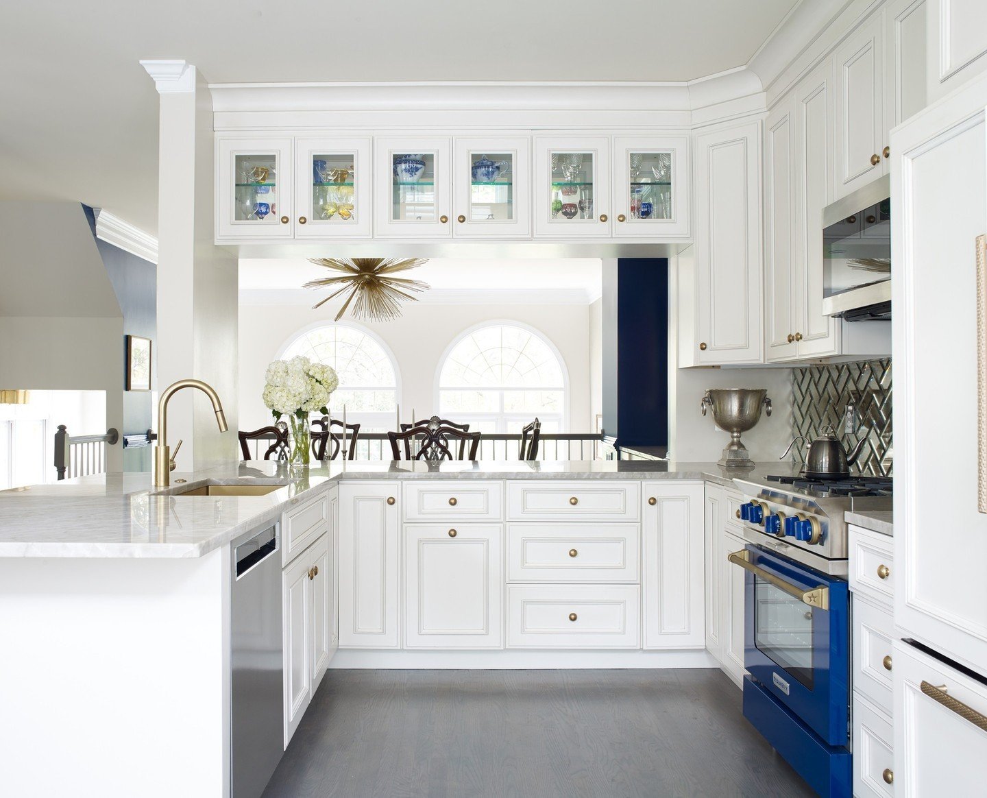 In this kitchen, timeless elegance meets modern functionality with clean lines, sleek surfaces, and enduring design elements. A classic white palette ensures this space remains eternally stylish.