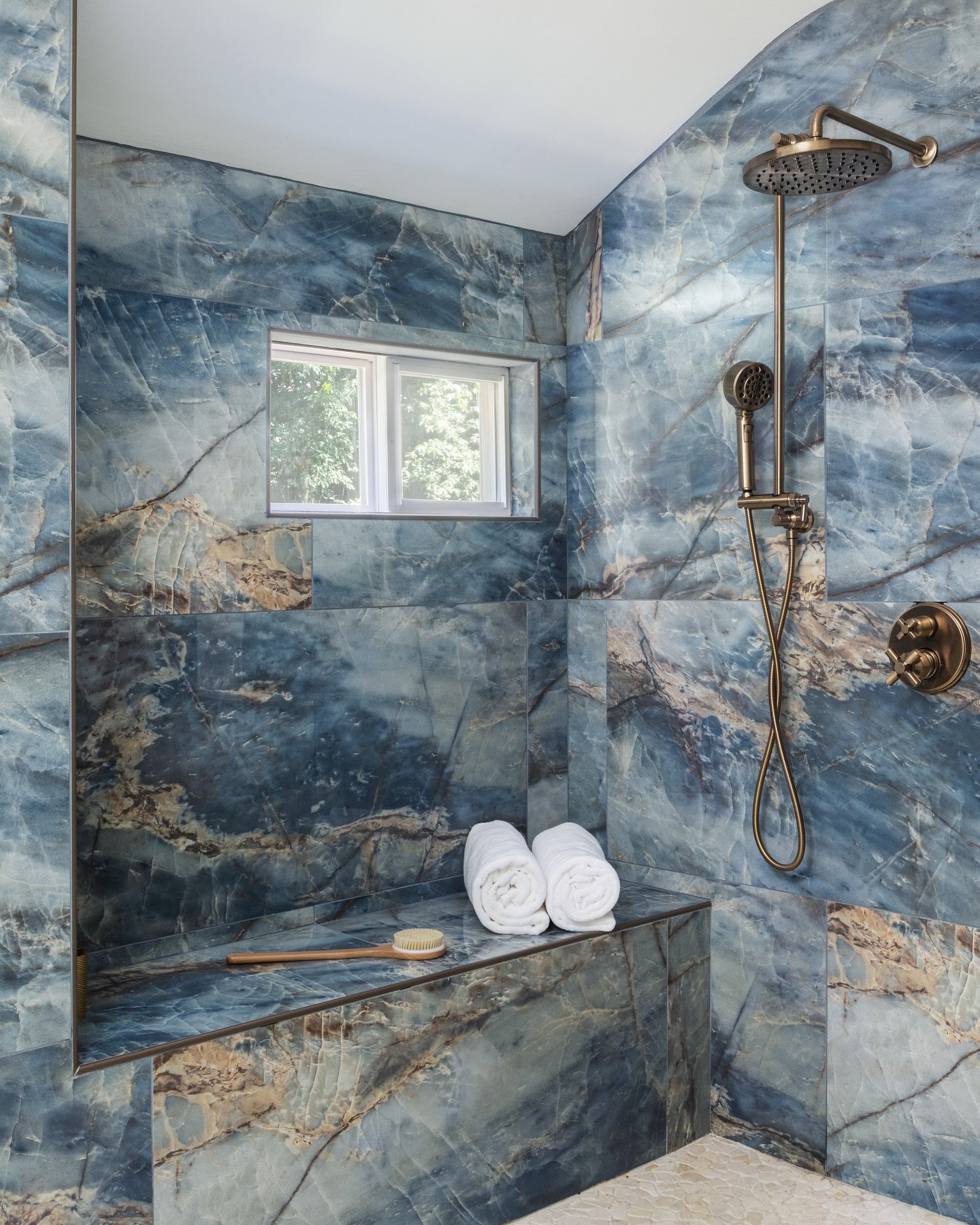 June is in full Bluem🔹We designed this stunning suburban Maryland bathroom, featuring floor-to-ceiling blue marbled quartz that adds a bold pop of color to the bathroom&rsquo;s sleek, modern design. #lornagrossinteriordesign #LornaGrossDesigns #June