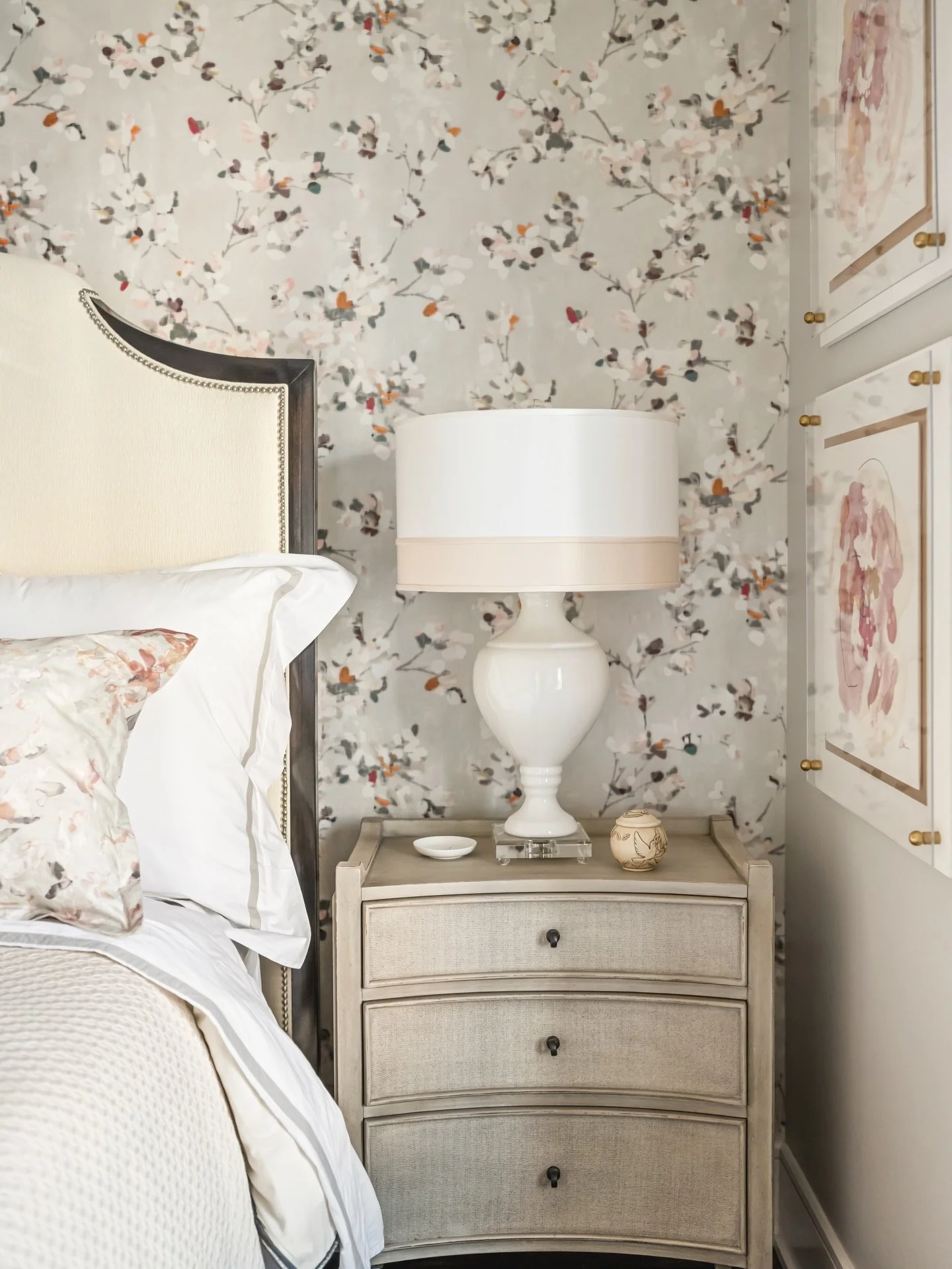 Florals are always in season. Soft, natural elements come together in this bedroom&mdash;floral wallpaper, subtle artwork, and neutral accents creating a space that feels delicate and cozy.

Photography provided by Tori Sikkema Photography @torisikke