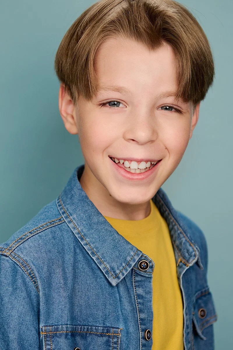 Commercial acting headshot of a young boy photographed in Orlando, Florida