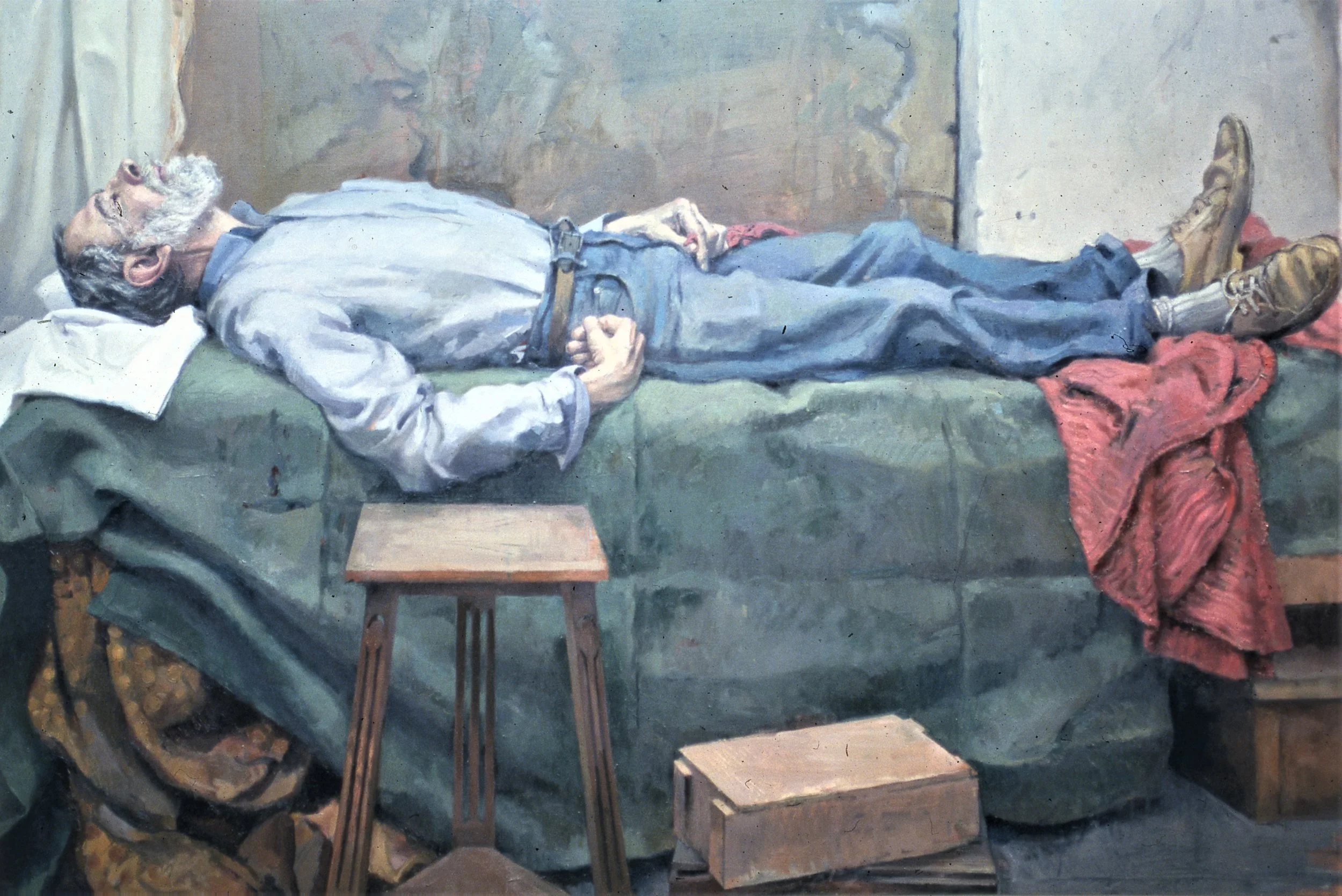 A painting of an elderly man lying on a bed with a pillow, resting with his eyes closed, hands clasped on his stomach, wearing a light gray shirt, jeans, and boots. There are two small stools beside the bed and a red blanket at the foot of the bed.