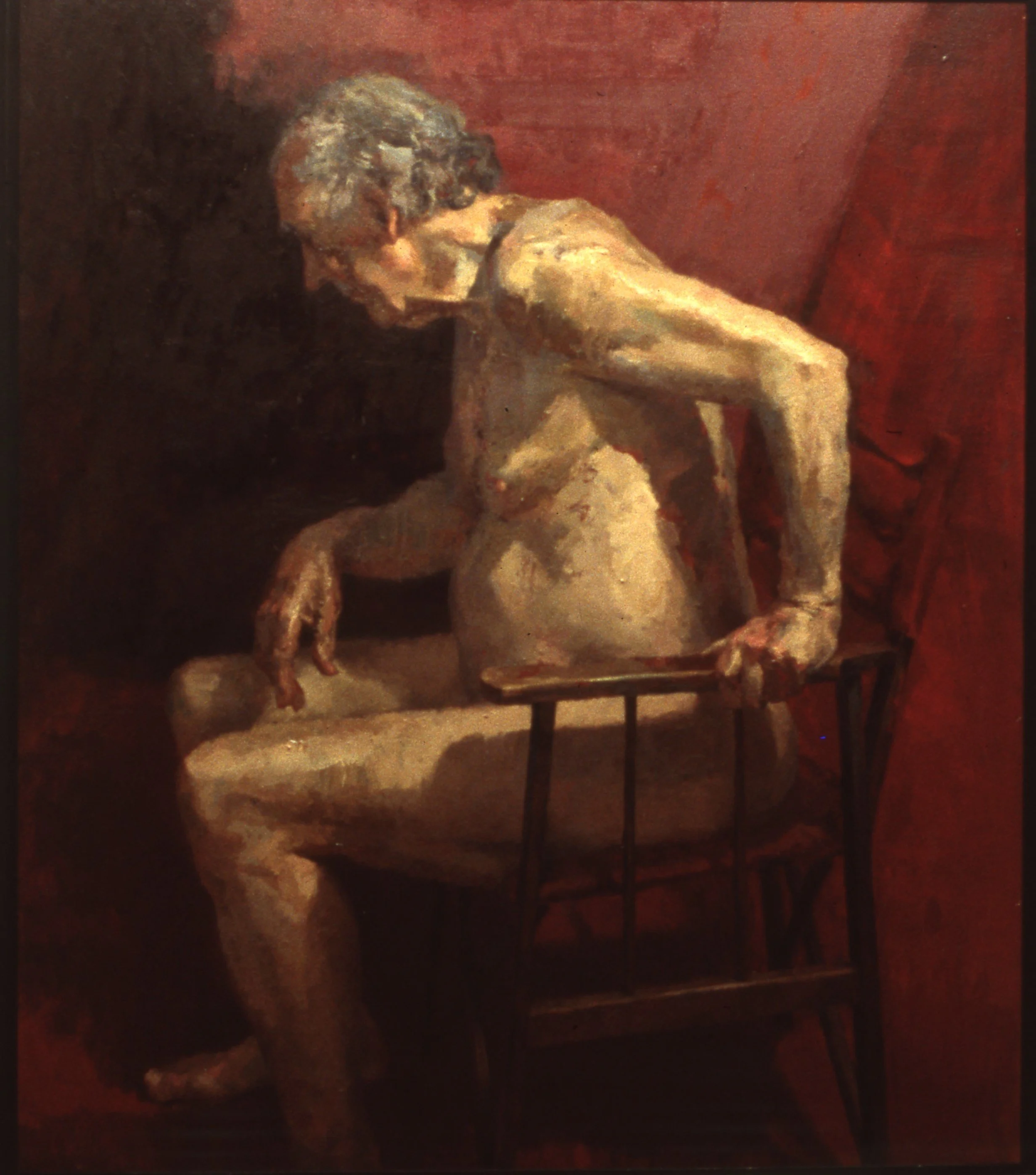 A painting of a nude woman sitting on a wooden chair with red backdrop, her head tilted downward and her left arm resting on her knee.