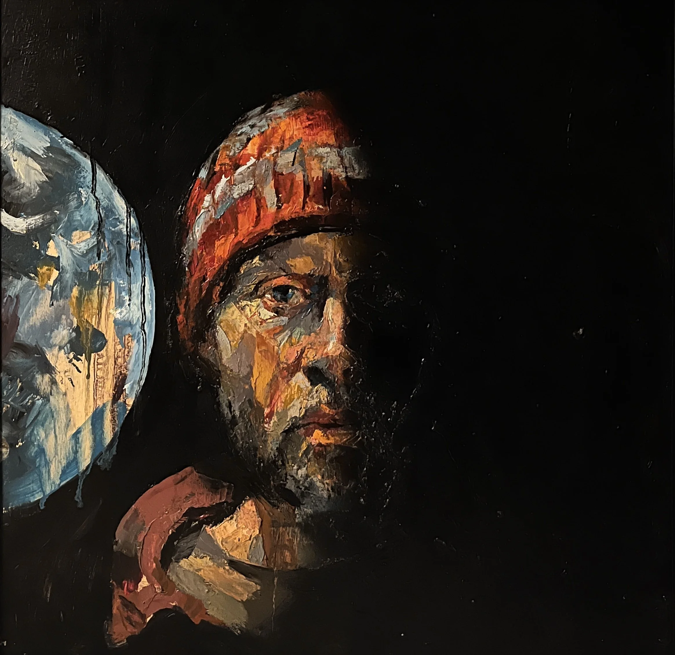 A painterly portrait of a young man with a serious expression, wearing a red beanie and holding a paintbrush, with a partially painted skull on a canvas in the background, set against a black background.