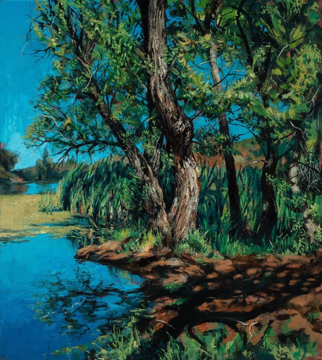 A painting of a riverside scene with trees, grass, and a blue sky reflected in the water.