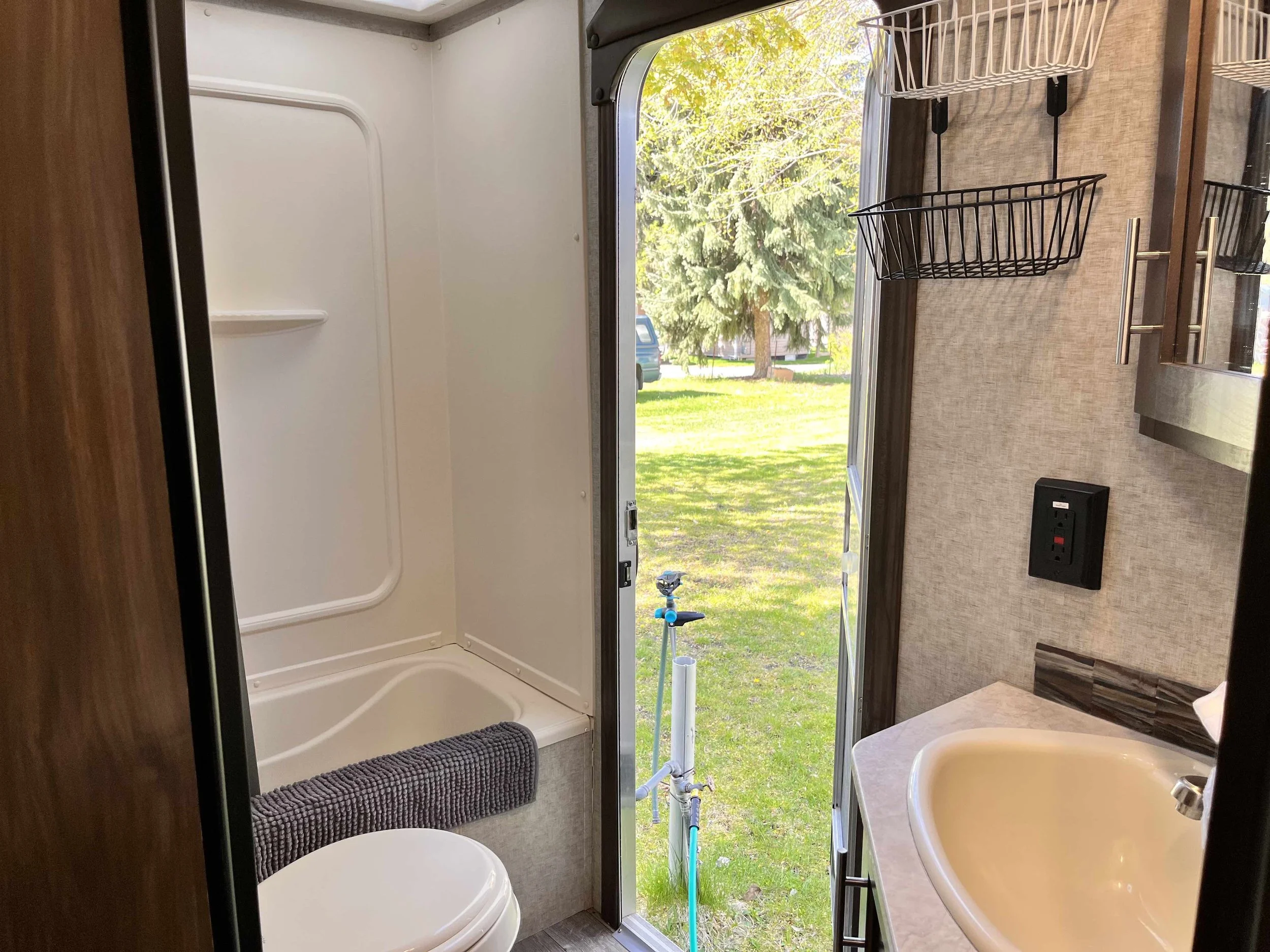 2nd RV door that gives you direct access to the bathroom. Great for keeping dirty kid footprints out of the RV.
