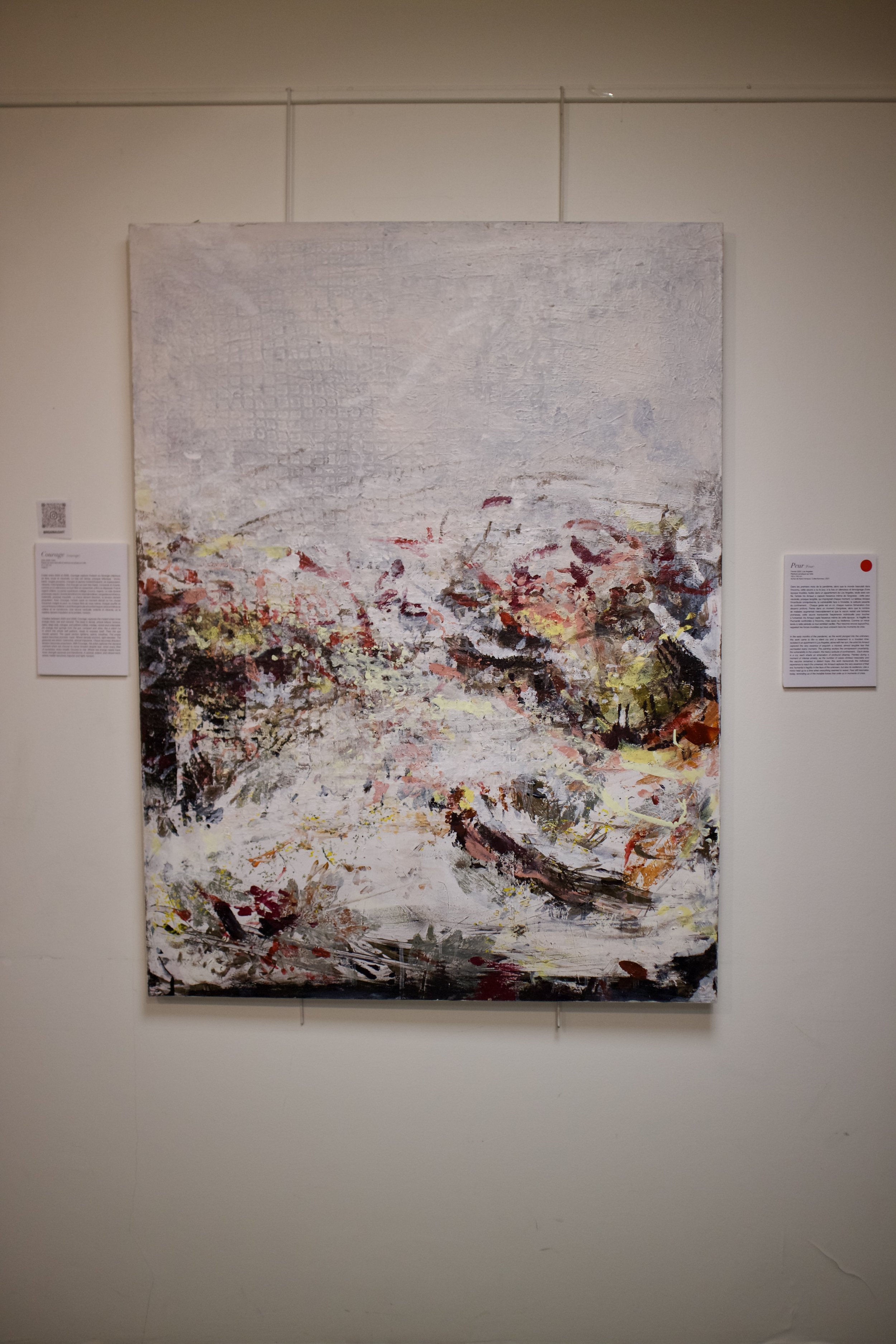 Abstract landscape painting with light colors, depicting a view of a river or lake surrounded by trees, with a textured sky above.