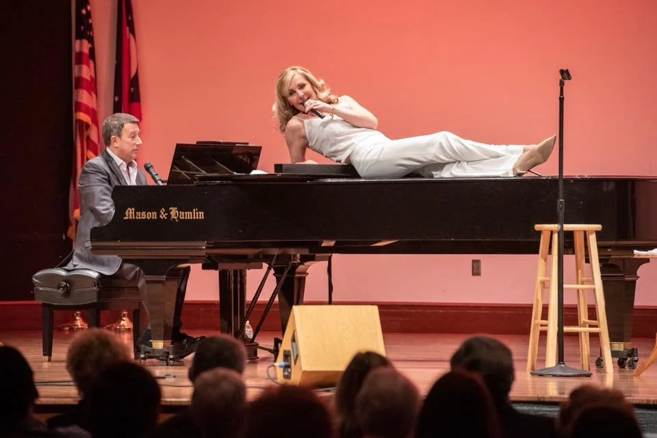Judy performing with Phil Reno at a benefit concert in Ohio