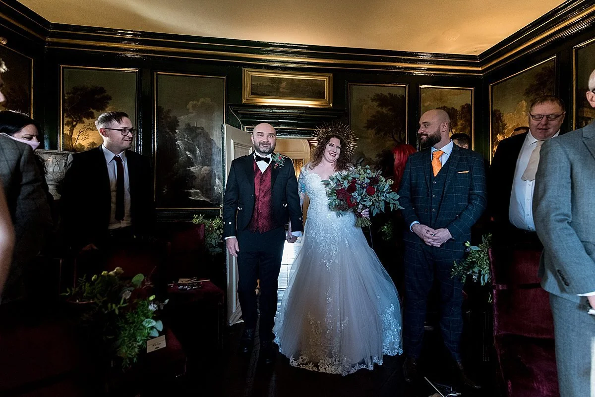 Couple entering their wedding in the Italian Room at Prestonfield House
