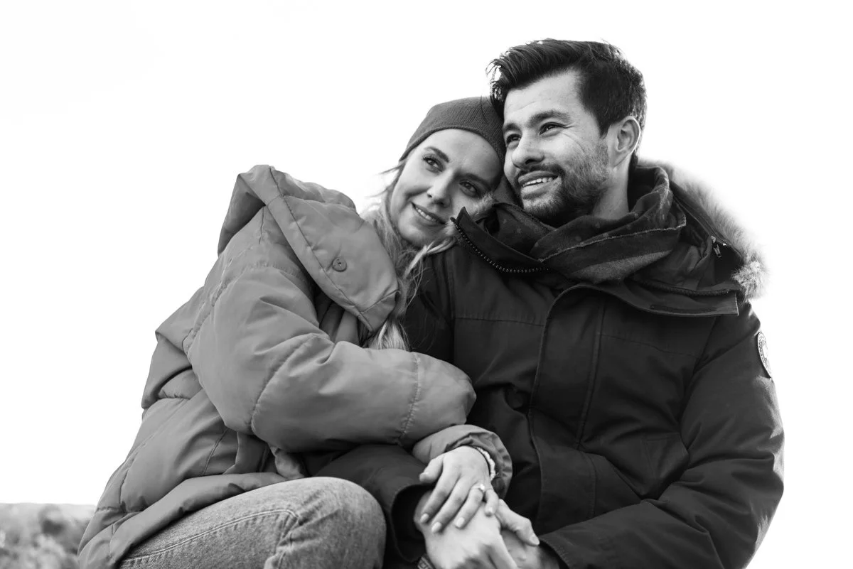engagement portrait of couple hugging in black and white