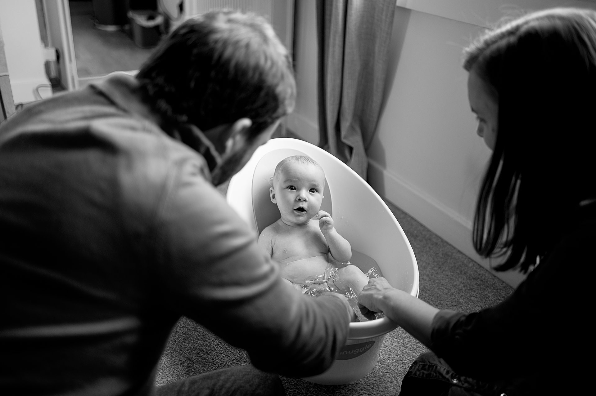 Black and white family photograph from baby photoshoot