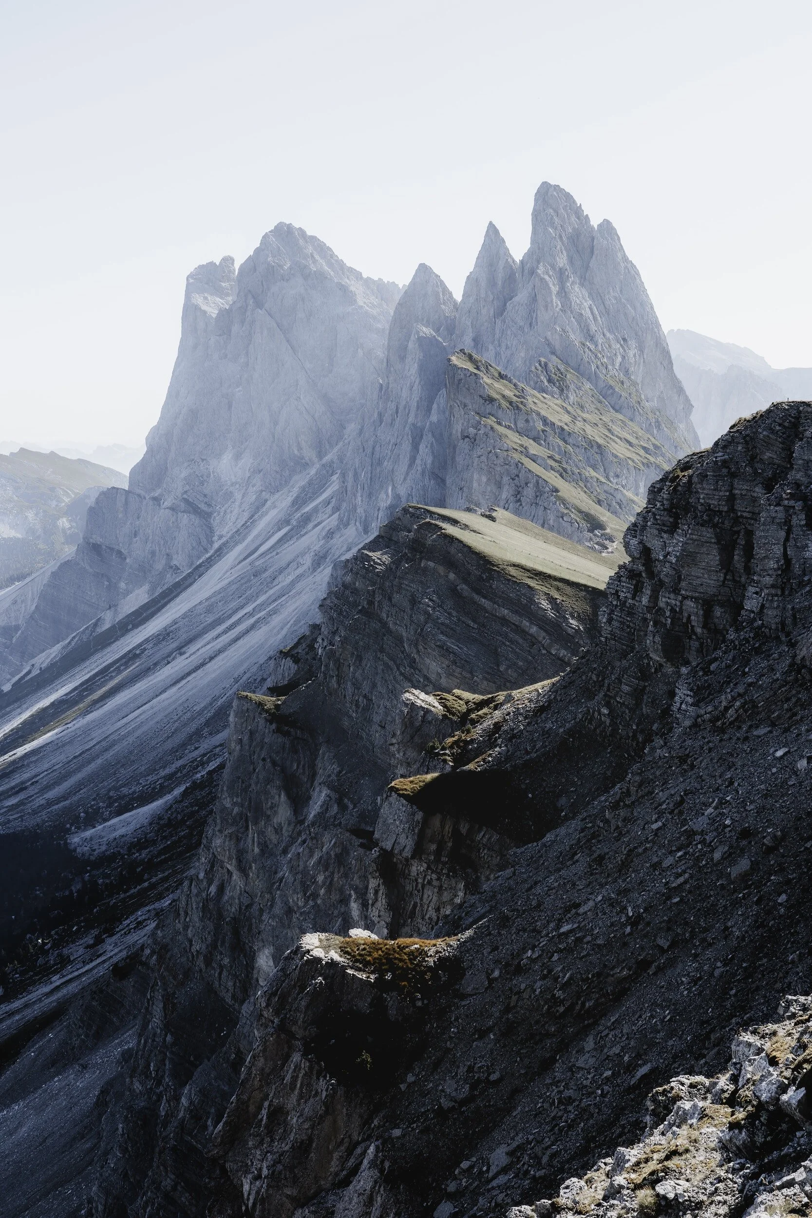 Jagged mountain peaks with sharp ridges and rocky slopes in a rugged landscape.